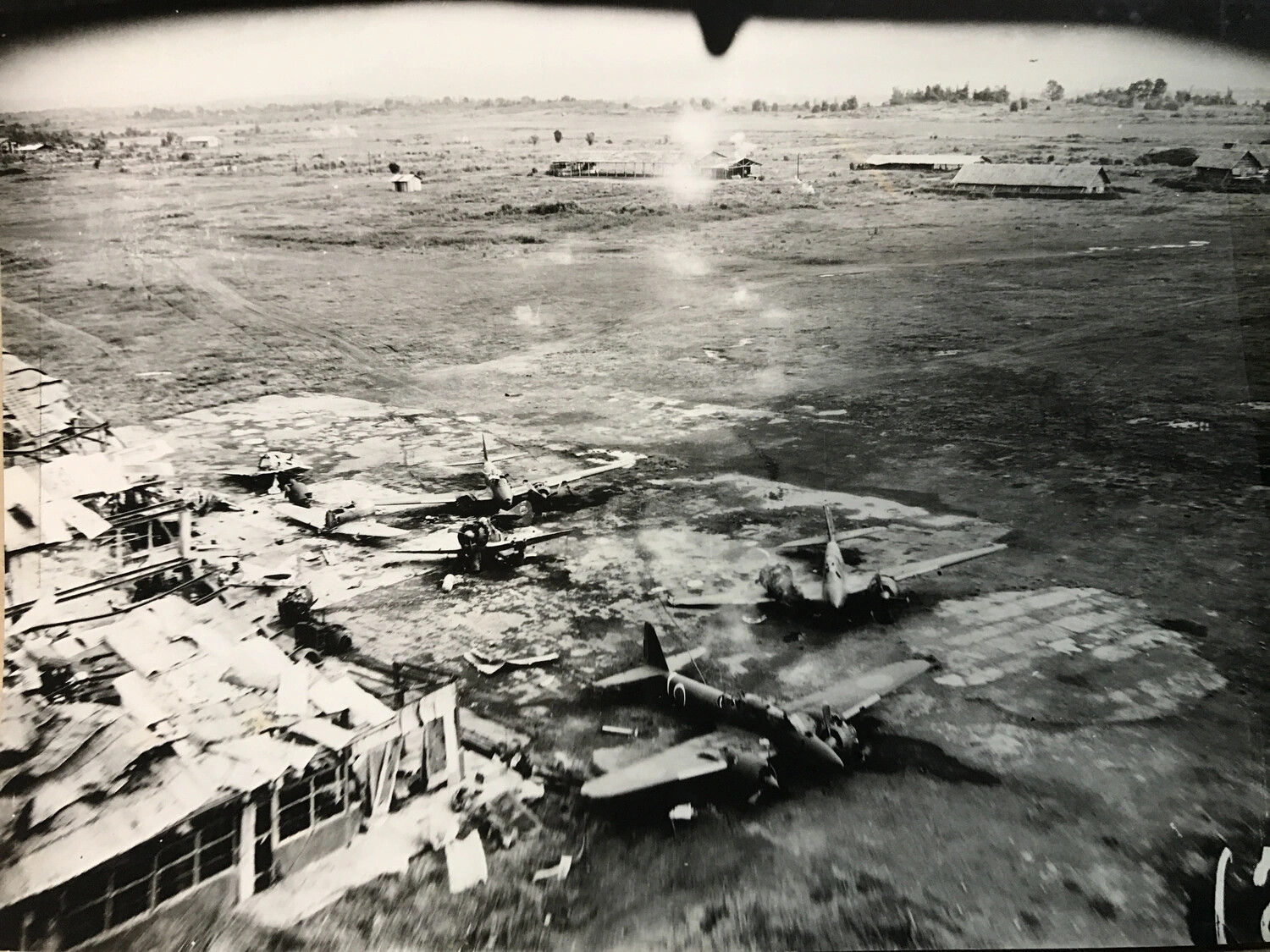 Destroyed Japanese Twin-Engine Bombers Beside Wrecked Hangar