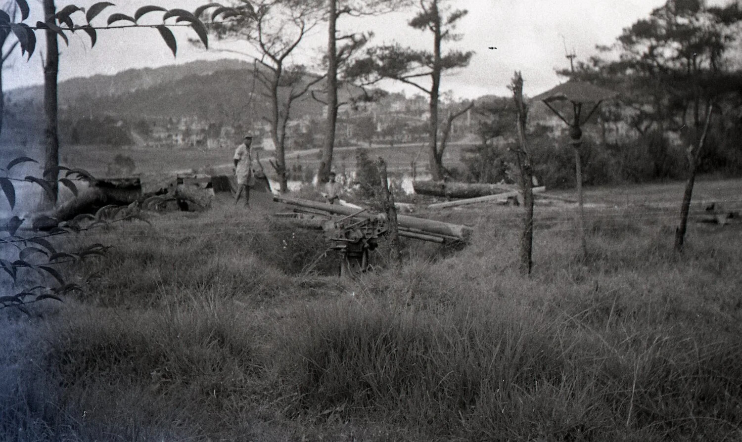 American Servicemen Inspecting a Captured Japanese Gun, Baguio Highlands, Luzon