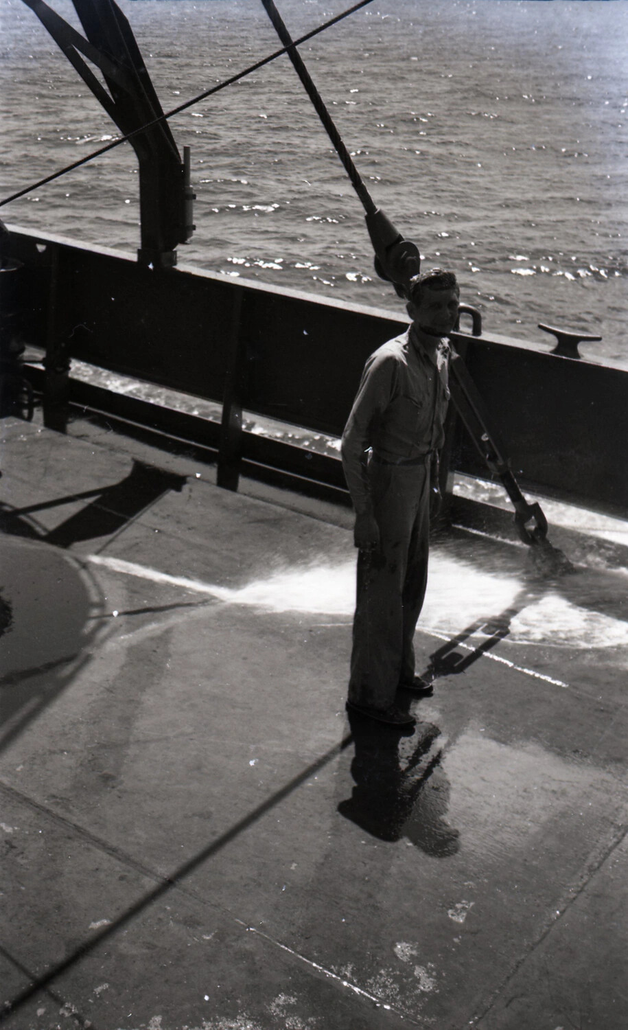 Crewman Washing Down Ship's Deck at Sea, WWII China-Burma-India Collection