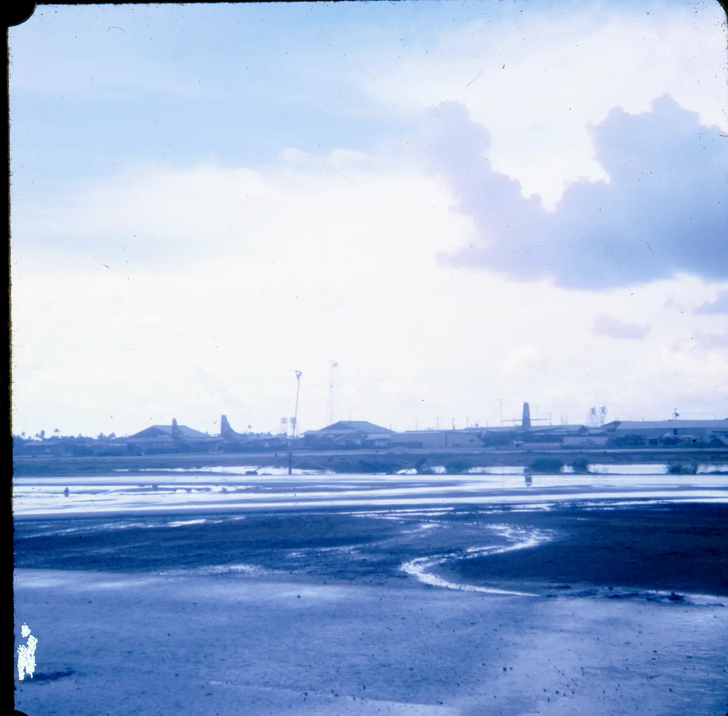 Distant View of a U.S. Airbase Across Tidal Flats, Vietnam War Era, 35mm Slide (S SAC Collection)