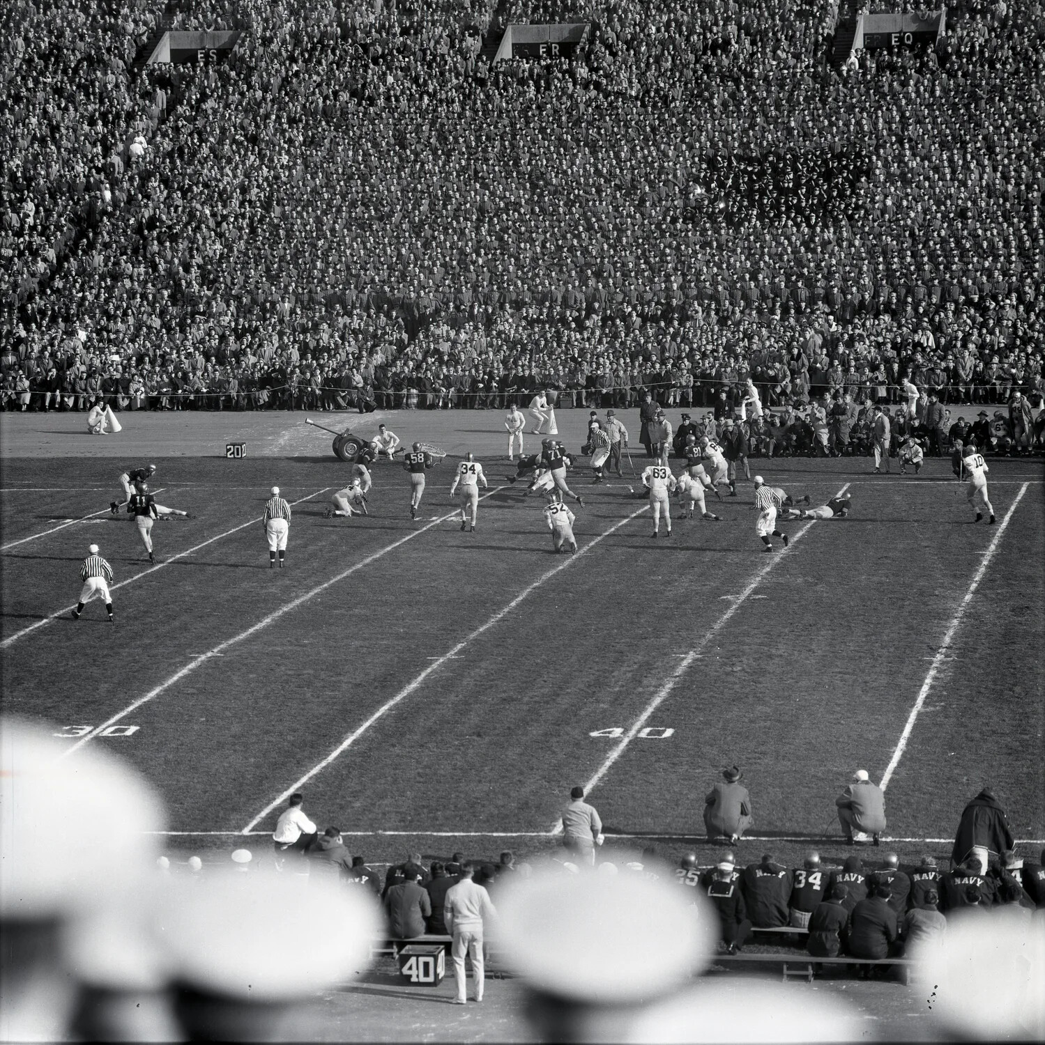 Army-Navy Football Game - Play Develops Near the 30-Yard Line with Navy Bench in Foreground
