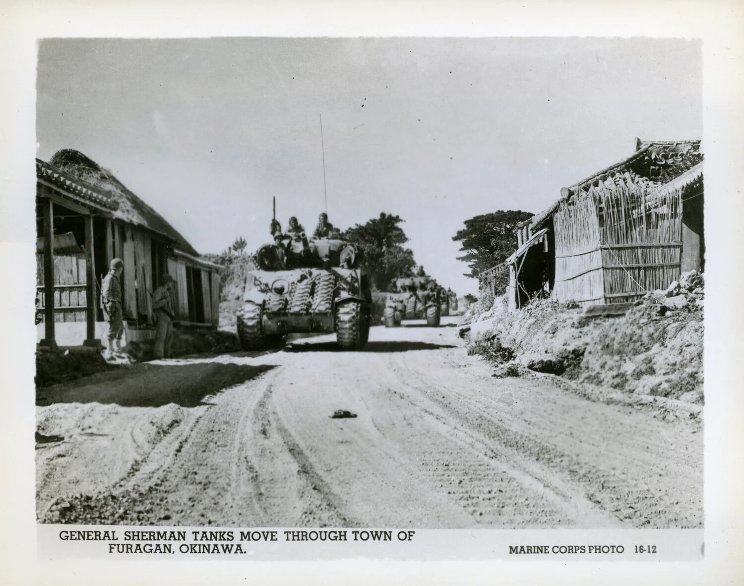 General Sherman Tanks Move Through Town of Furagan, Okinawa