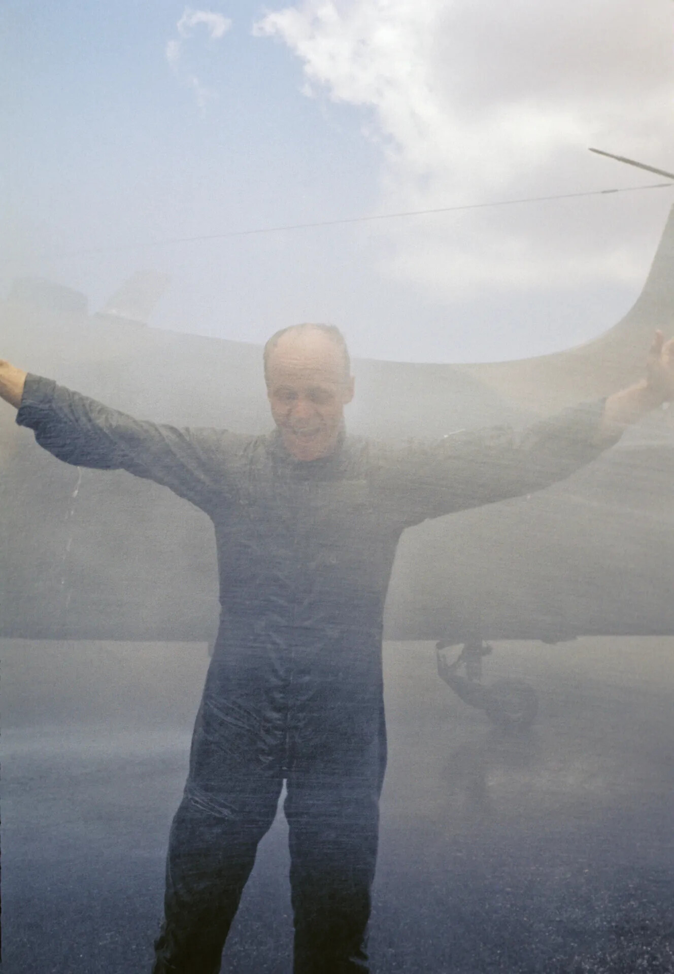 Pilot in Flight Suit Celebrated with Water Salute Beside Aircraft Tail, Vietnam War Era (Don Engebretsen Slide Collection)