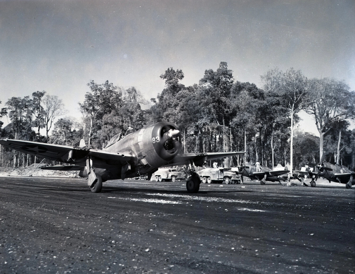P-47 Thunderbolt Fighter '83' Taxiing on Forward Airstrip, China-Burma-India Theater