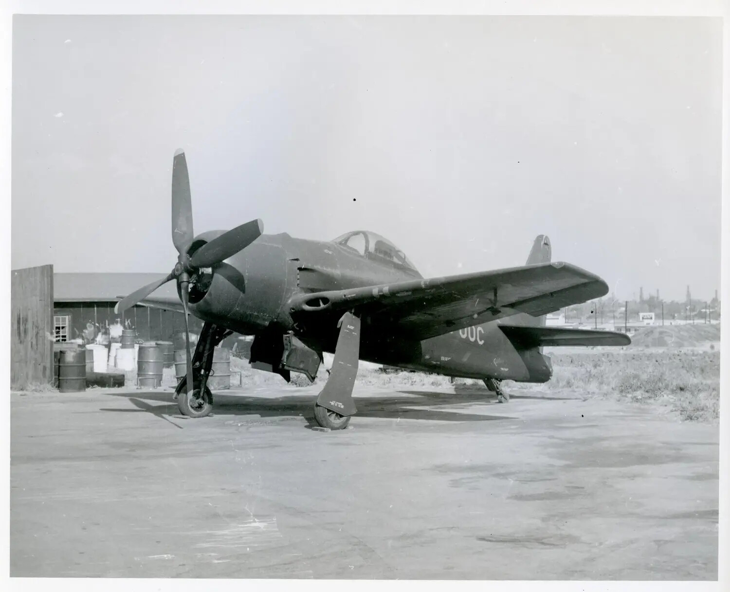 Single-Engine Radial Fighter Aircraft on Ramp, Factory/Test Field