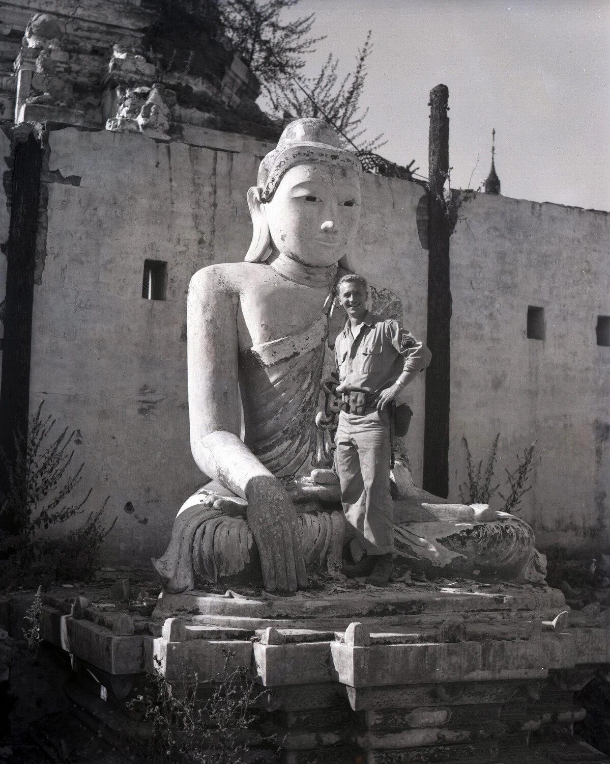 U.S. Army Soldier Posing with Damaged Buddha Statue Amid Pagoda Ruins, Myitkyina, Burma, WWII