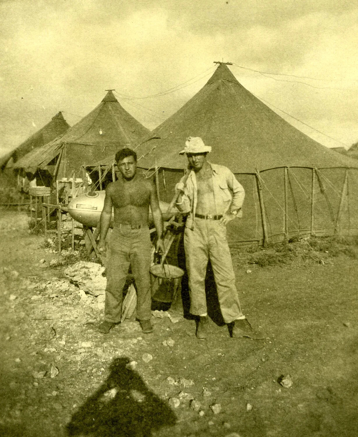 Two Airmen with Repurposed Drop-Tank Water Rig at Tent Camp, Ie Shima, WWII Photo Album