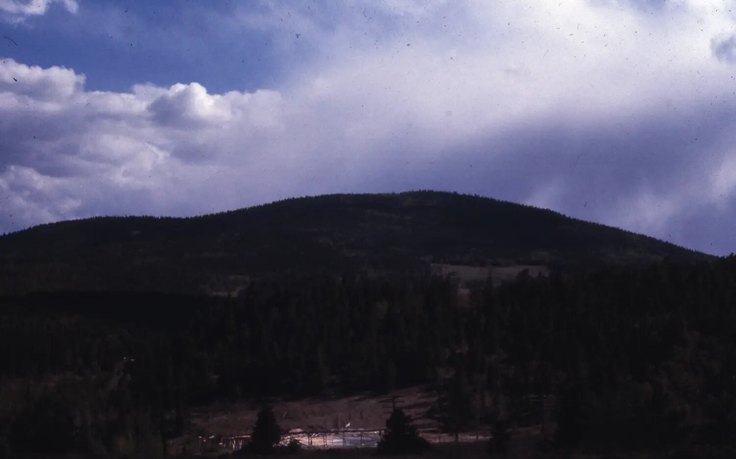 Silhouetted Mountain Landscape Under Storm Clouds, Colorado, Vietnam War-Era Travel Photograph