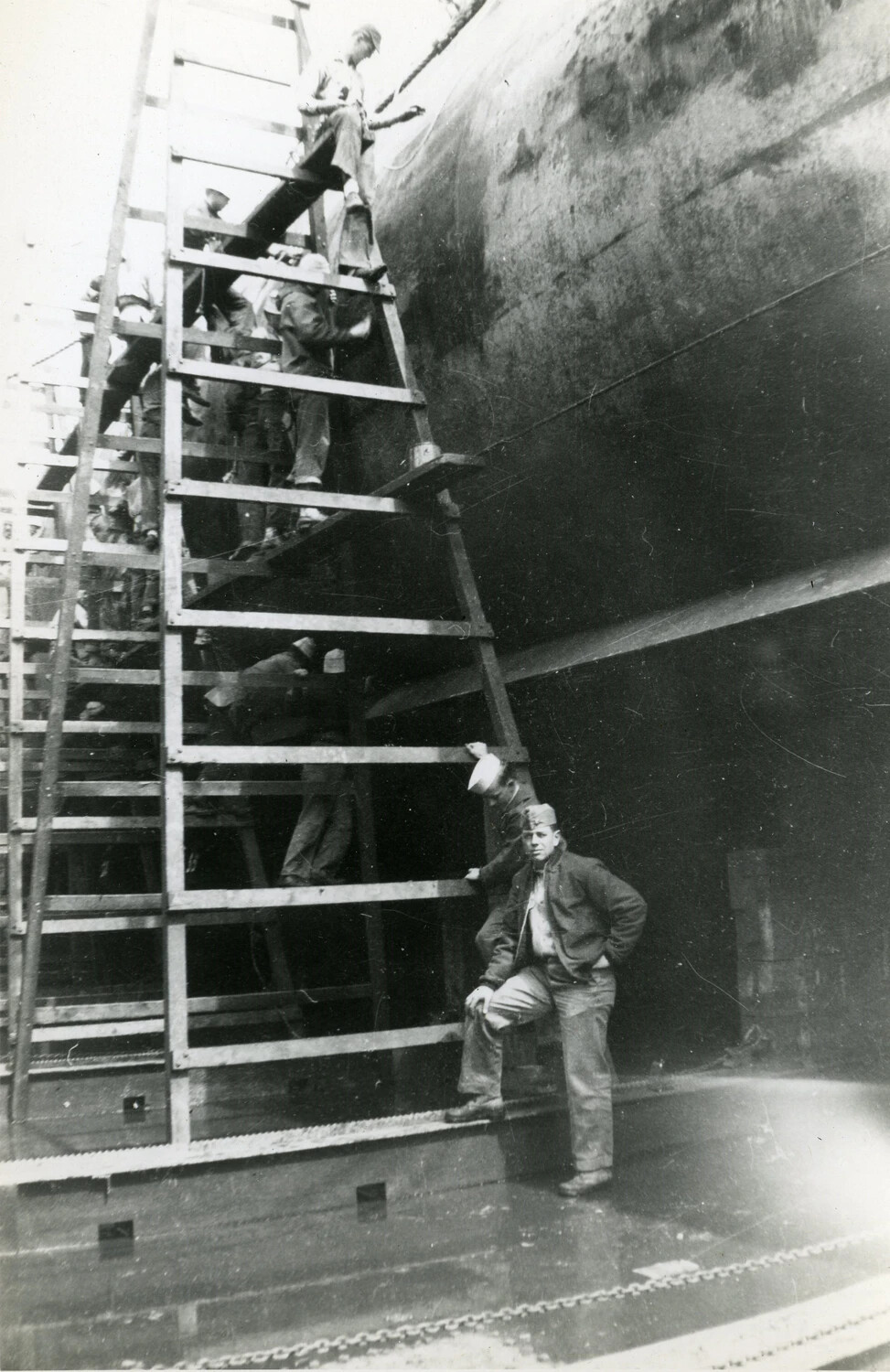 Sailors and Yard Workers on Scaffolding Alongside Submarine Hull in Dry Dock, USS Charr (SS-328) Collection