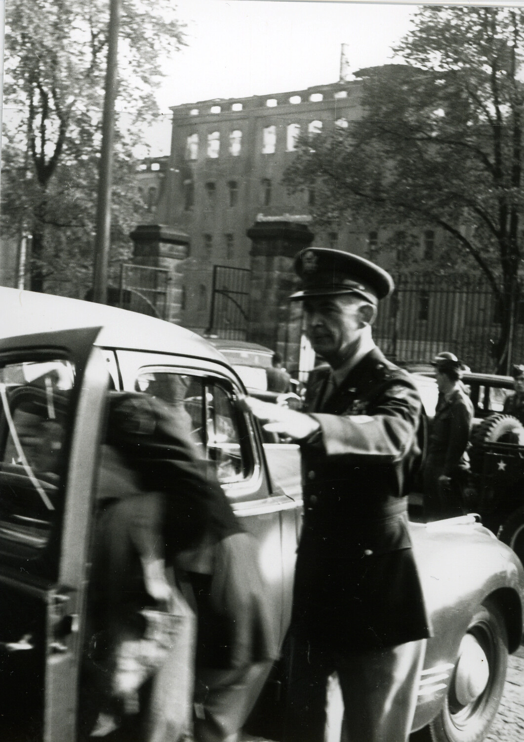U.S. Army Officer Assisting at Vehicle, Nuremberg, Postwar Germany