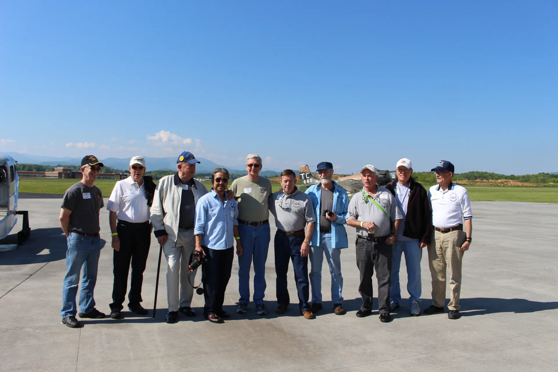 Veterans Reunion Group Portrait with A-1 Skyraider 'TC 665', Airport Ramp, 2 May 2015