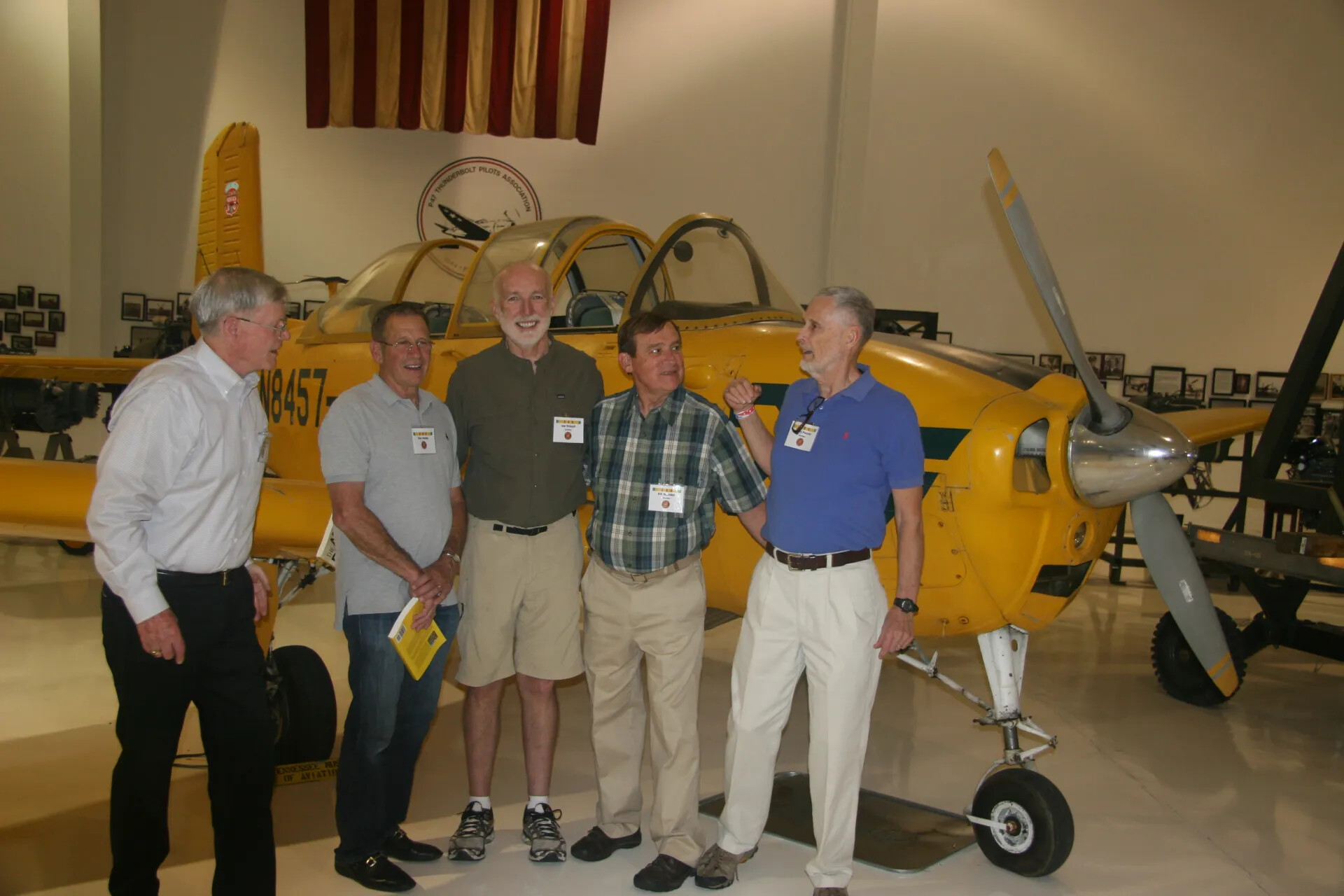 Reunion Attendees Beside Vintage Trainer Aircraft, Operation Tailwind Event, April 2016