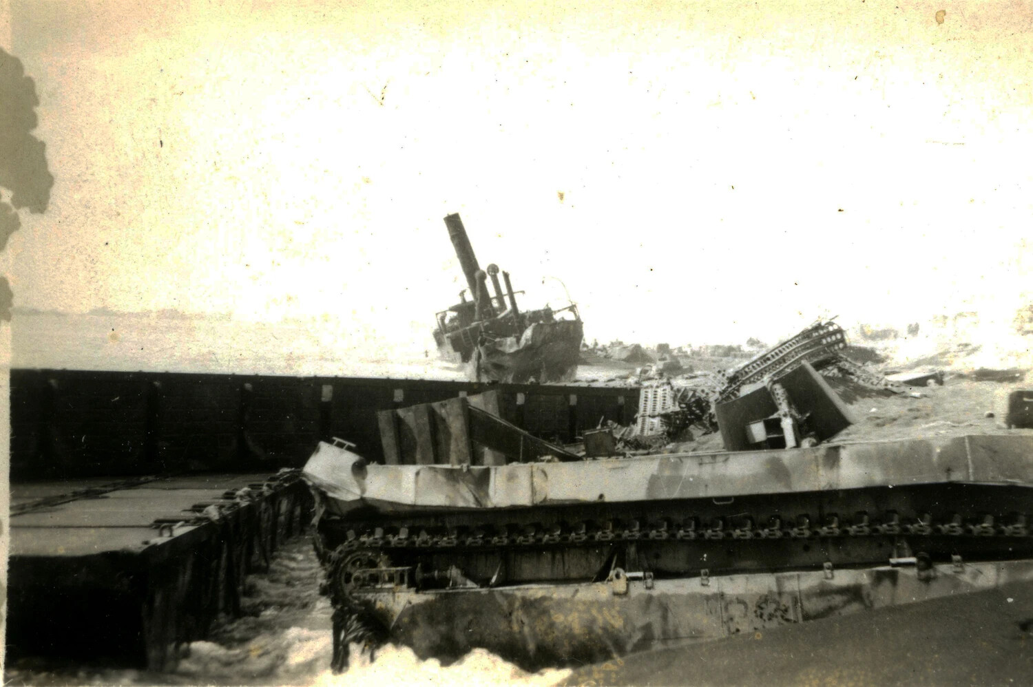Wrecked Amphibious Tractor and Beached Vessel on Iwo Jima Landing Beach, 1945