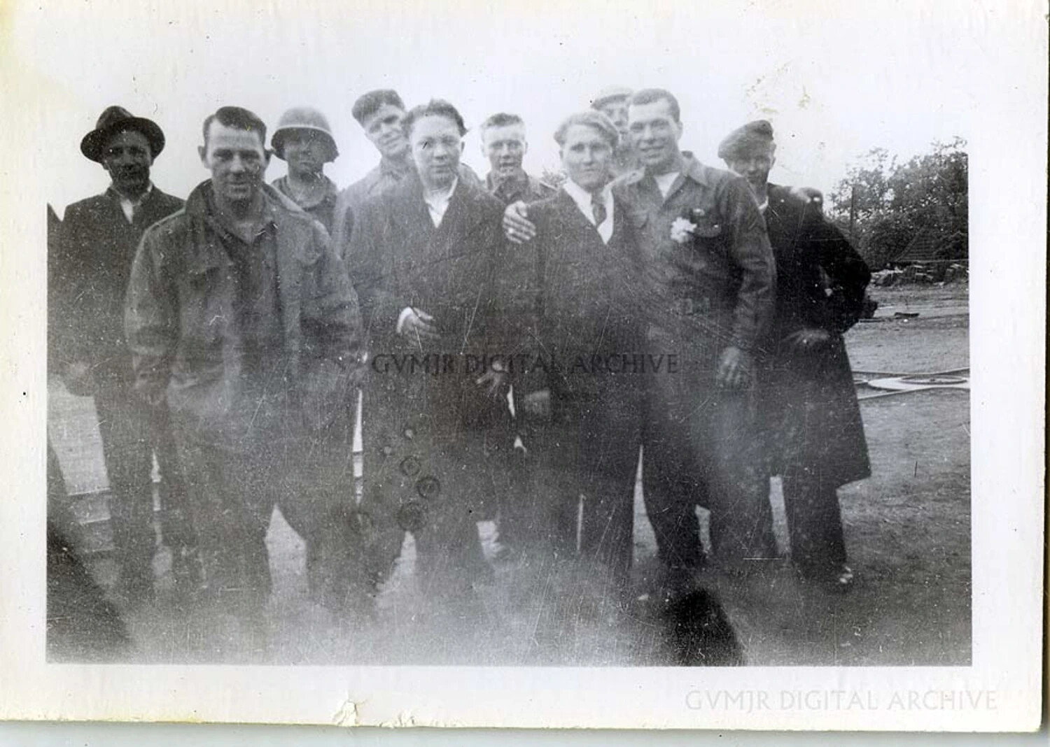 Group Portrait of Men in Mixed Civilian and Military Dress, Associated with the 101st Airborne Division