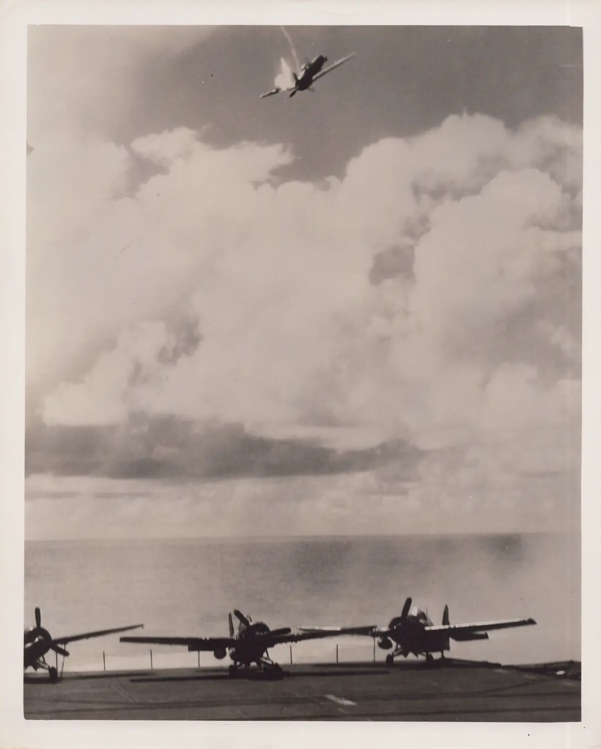 Aircraft Hit by Anti-Aircraft Fire Above Escort Carrier Flight Deck, October 25, 1944