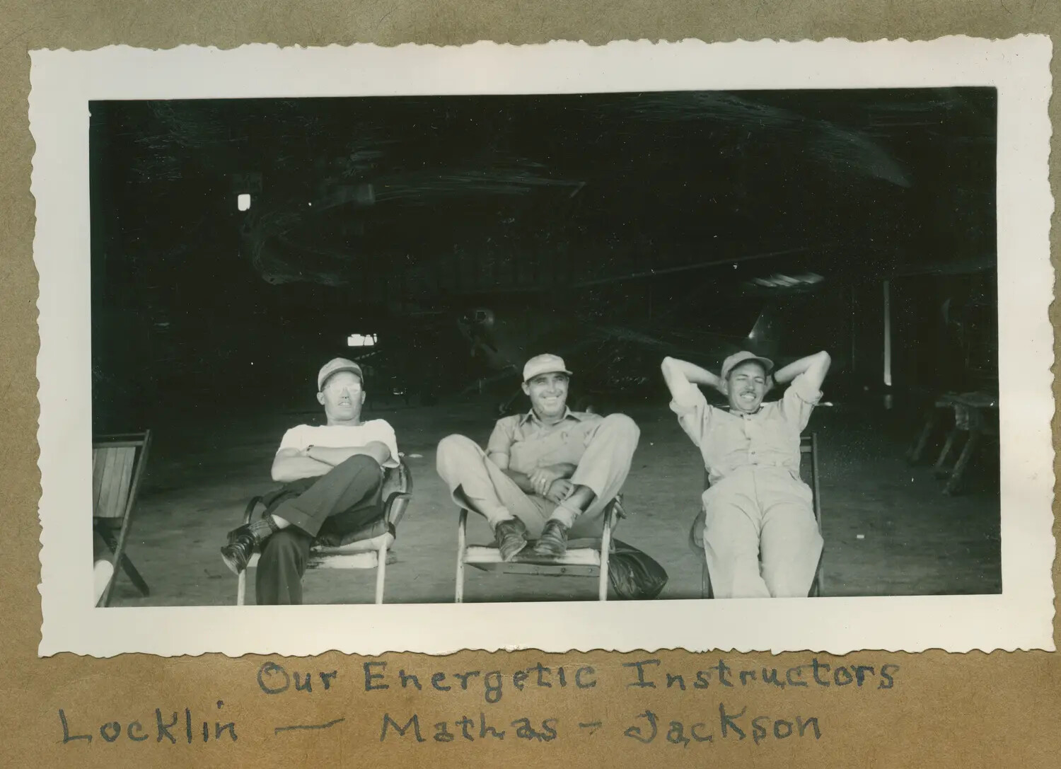 Civilian Flight Instructors Locklin, Mathas, and Jackson at Rest in Hangar – V-5 Naval Aviation Cadet Program, WWII Era