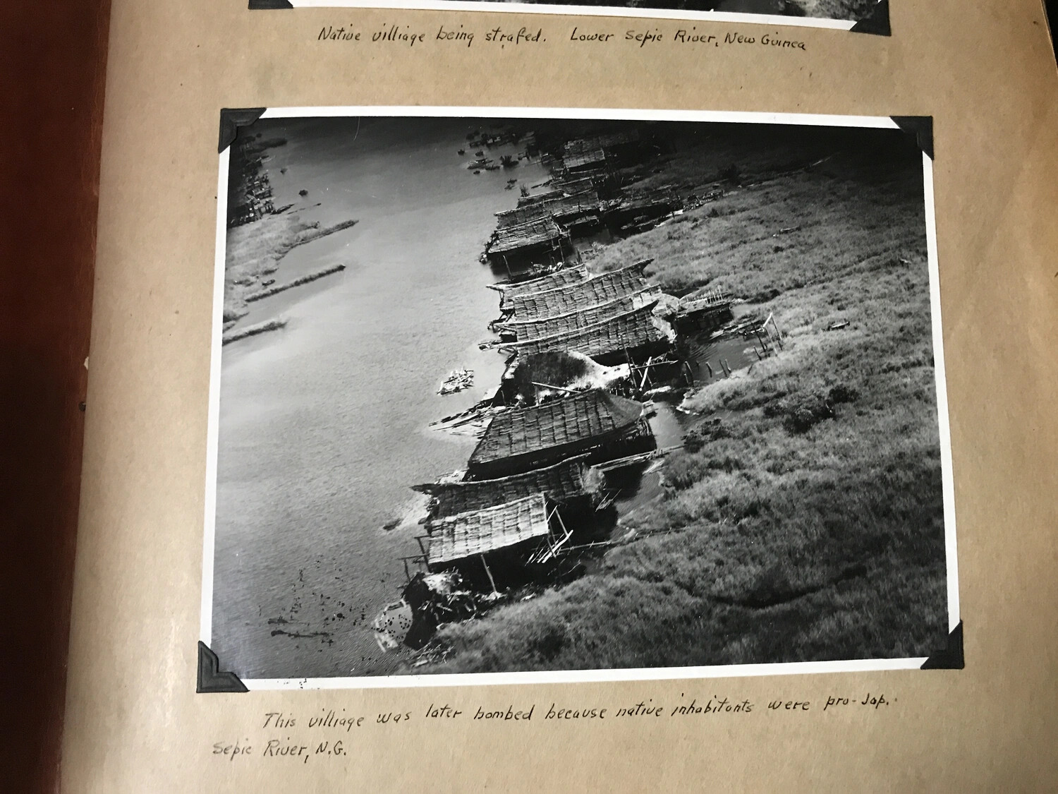 Album Page: 'This Village Was Later Bombed Because Native Inhabitants Were Pro-Jap' — Sepik River, New Guinea