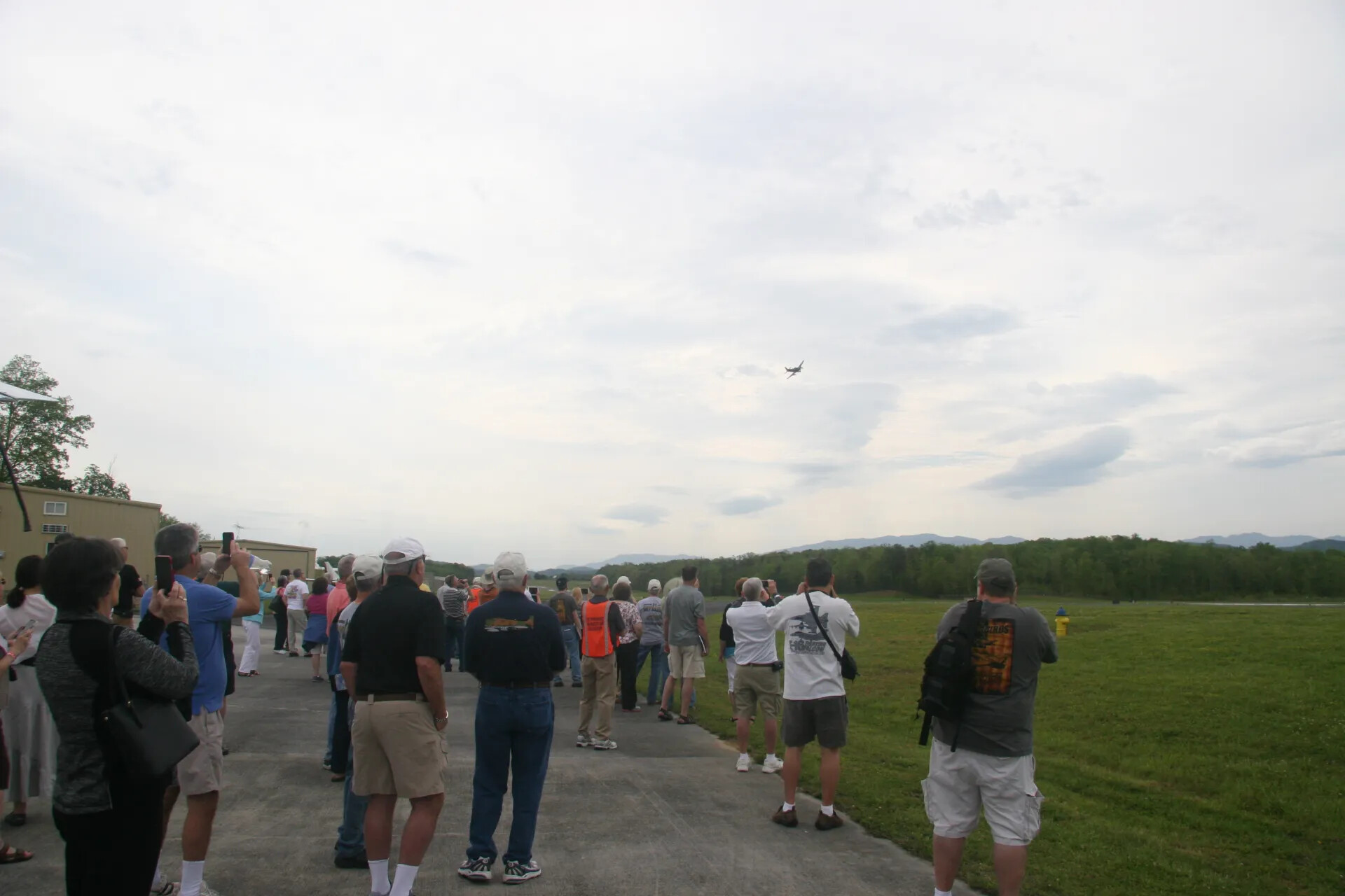 Crowd Near Hangar Watches A-1 Skyraider Flyover, Operation Tailwind Event, 2016 (Sequence Frame)