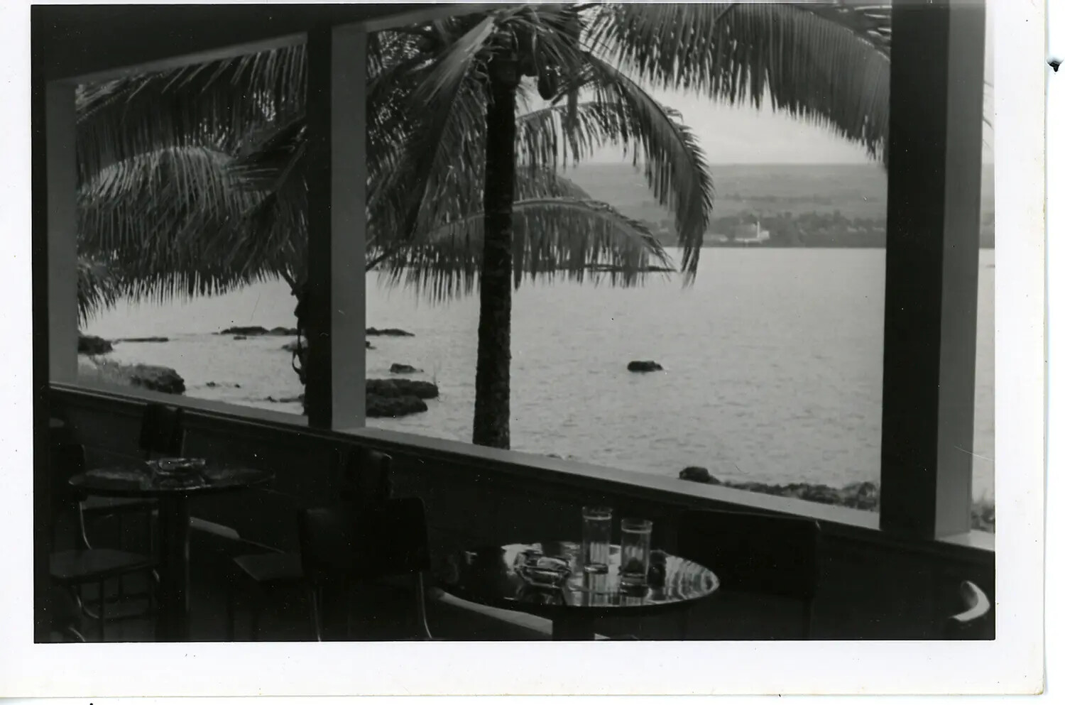 Restaurant Lanai Overlooking a Rocky Bay, Likely Hawaii, Mid-20th Century (Probable Post-WWII/Tourism Era)