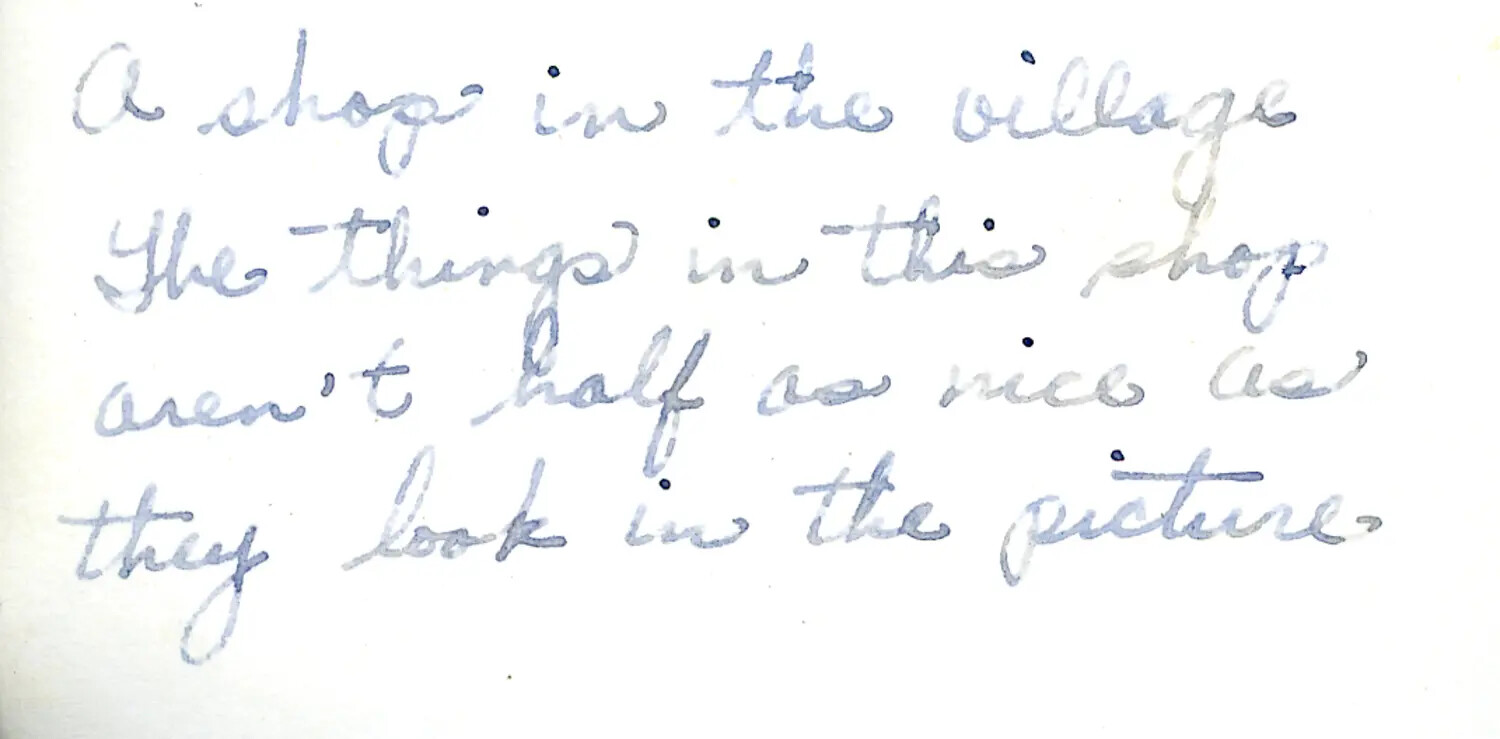 Handwritten Caption Note: "A Shop in the Village" -- CBI Theater Photo Album Annotation