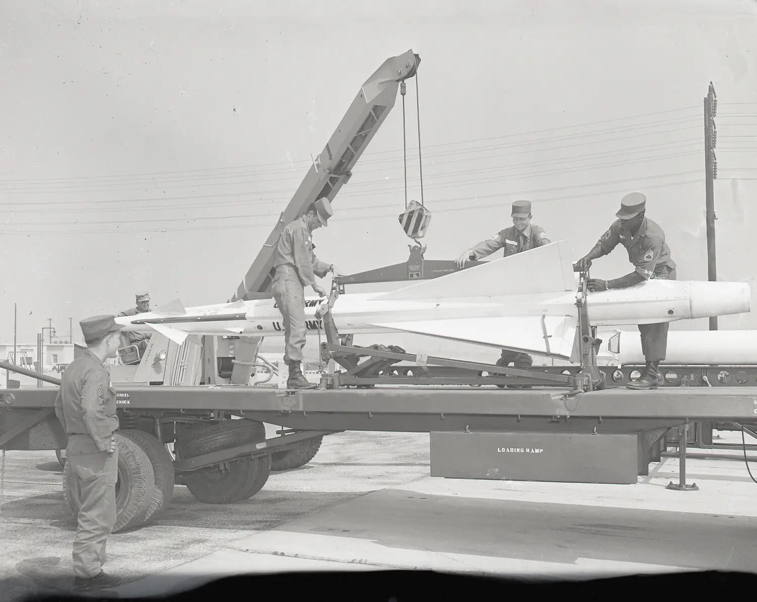 U.S. Army Soldiers Loading a Nike Surface-to-Air Missile onto a Transport Trailer