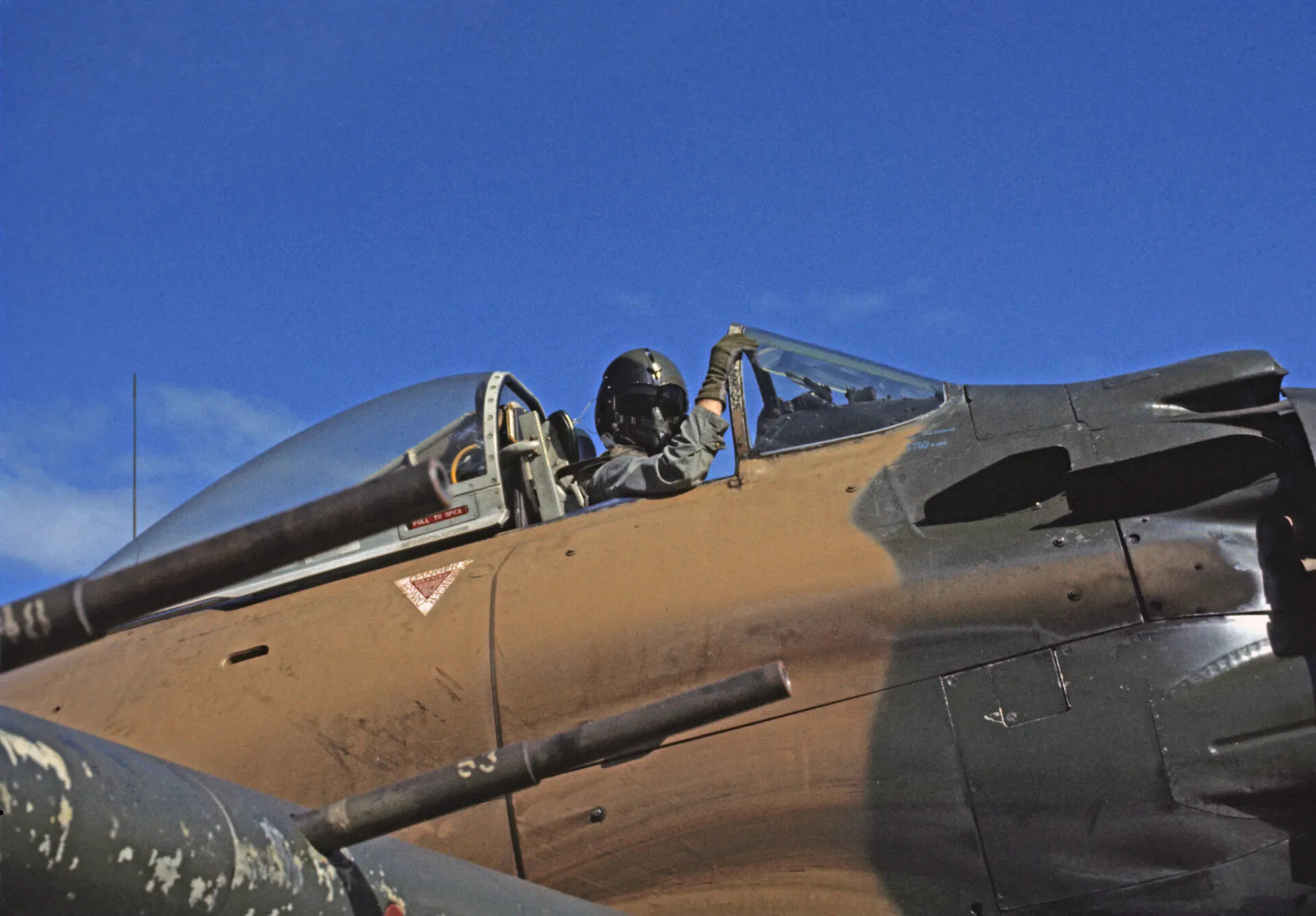 Air Force Pilot Preparing for Flight in A-1 Skyraider Cockpit