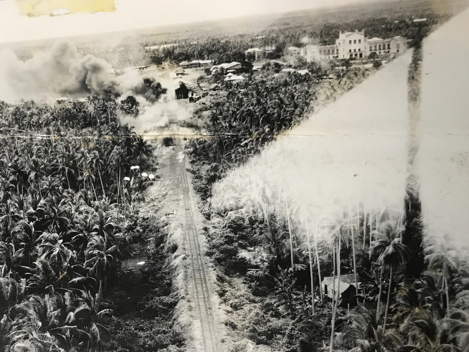 Aerial Strike Photograph of Railway and Town Under Attack, Philippines Theater, 312th Bomb Group