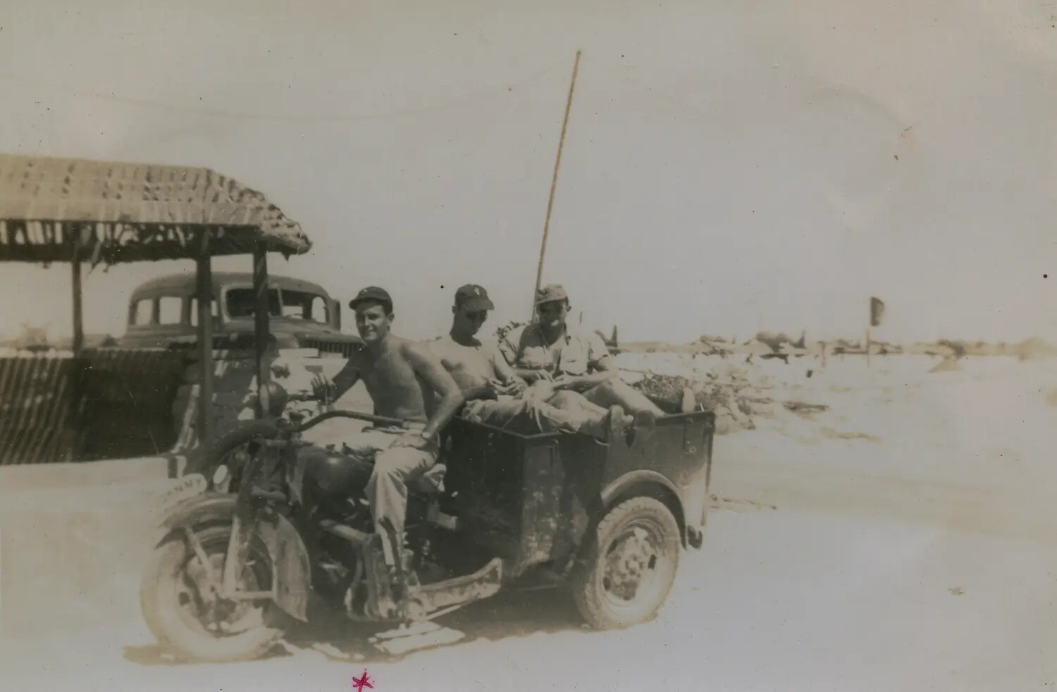 USAAF Airmen with a Harley-Davidson Utility Trike at a Pacific Theater Airfield