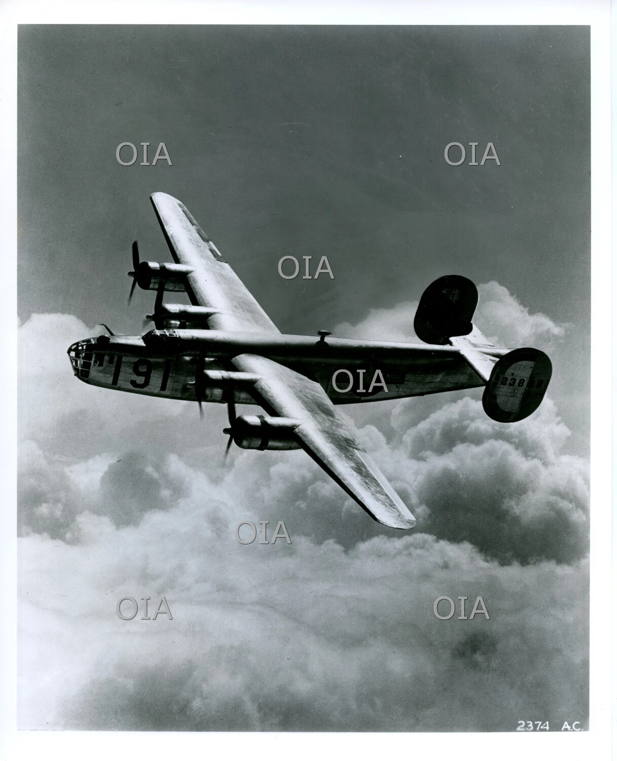 Consolidated B-24 Liberator Heavy Bomber Banking Above Clouds