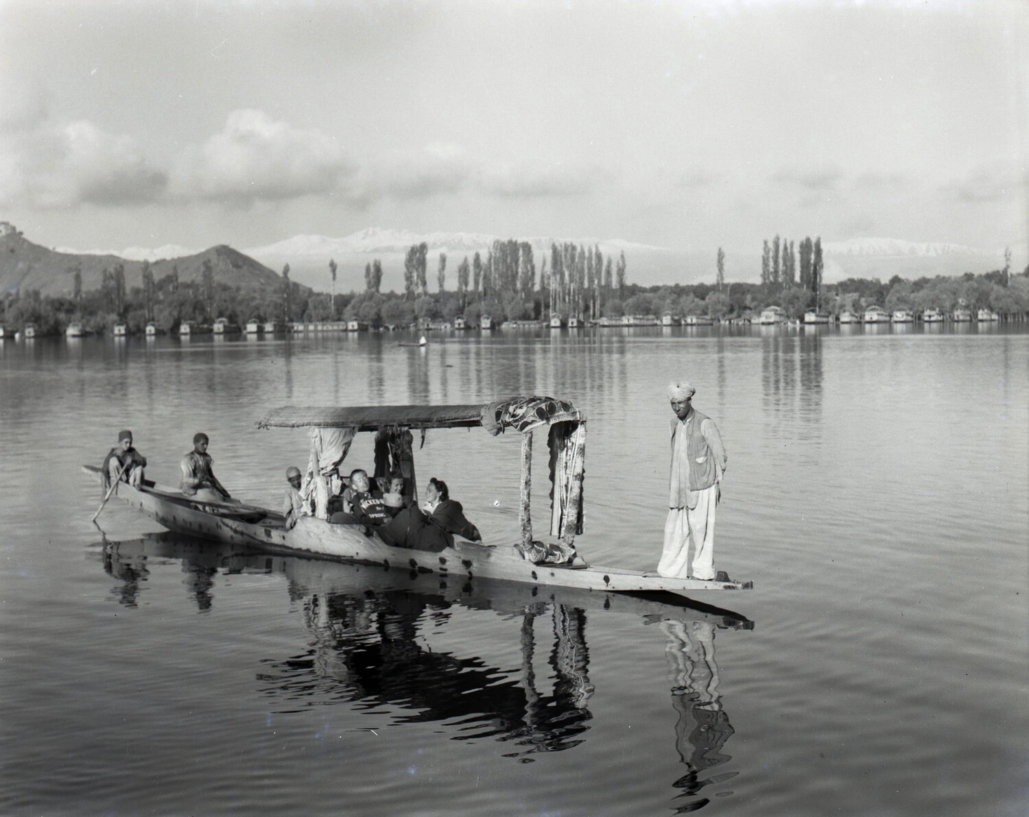 Shikara Boat with Passengers on Dal Lake, Srinagar, Kashmir