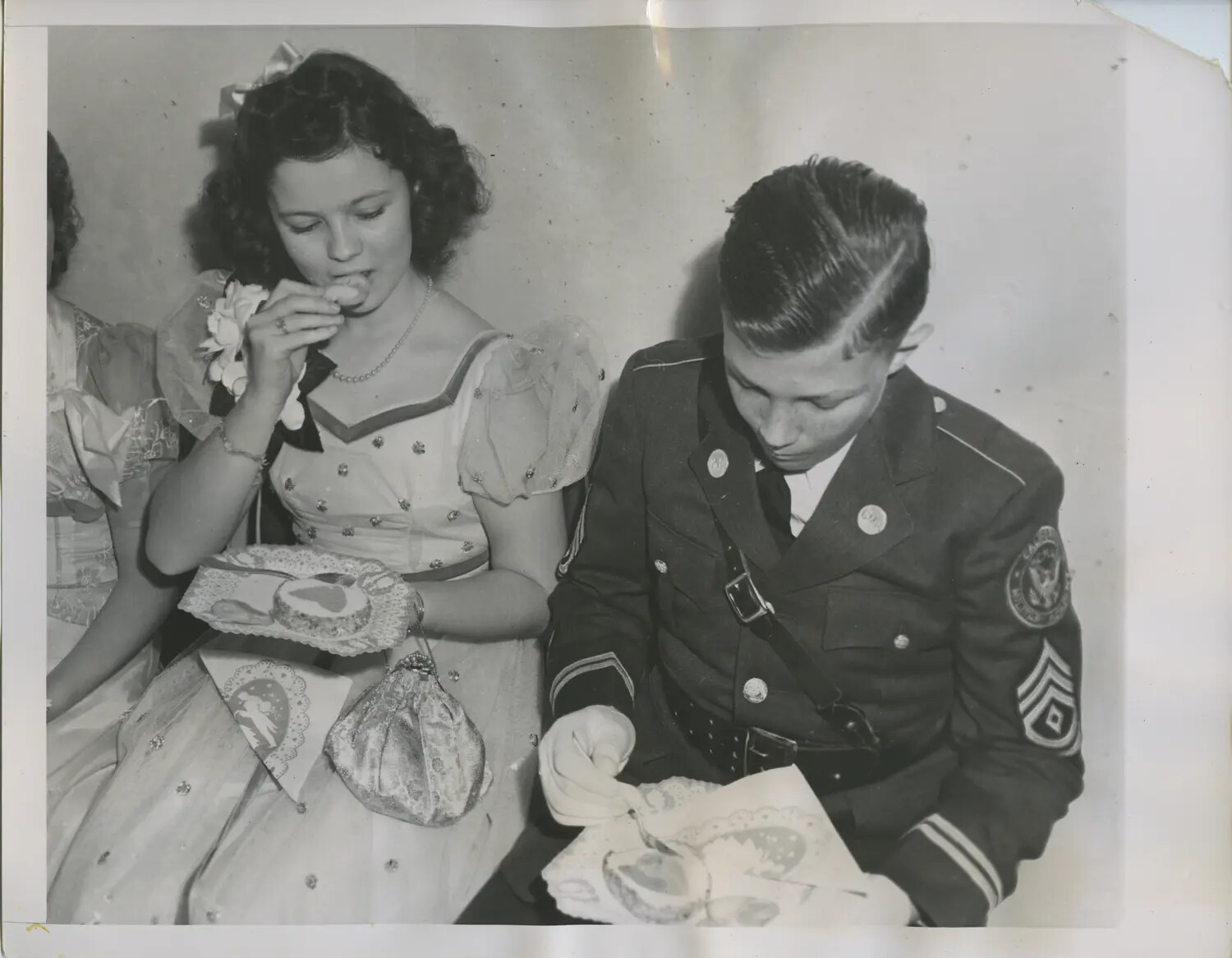 Military Academy Cadet and Date Sharing Cake at Formal School Social Event