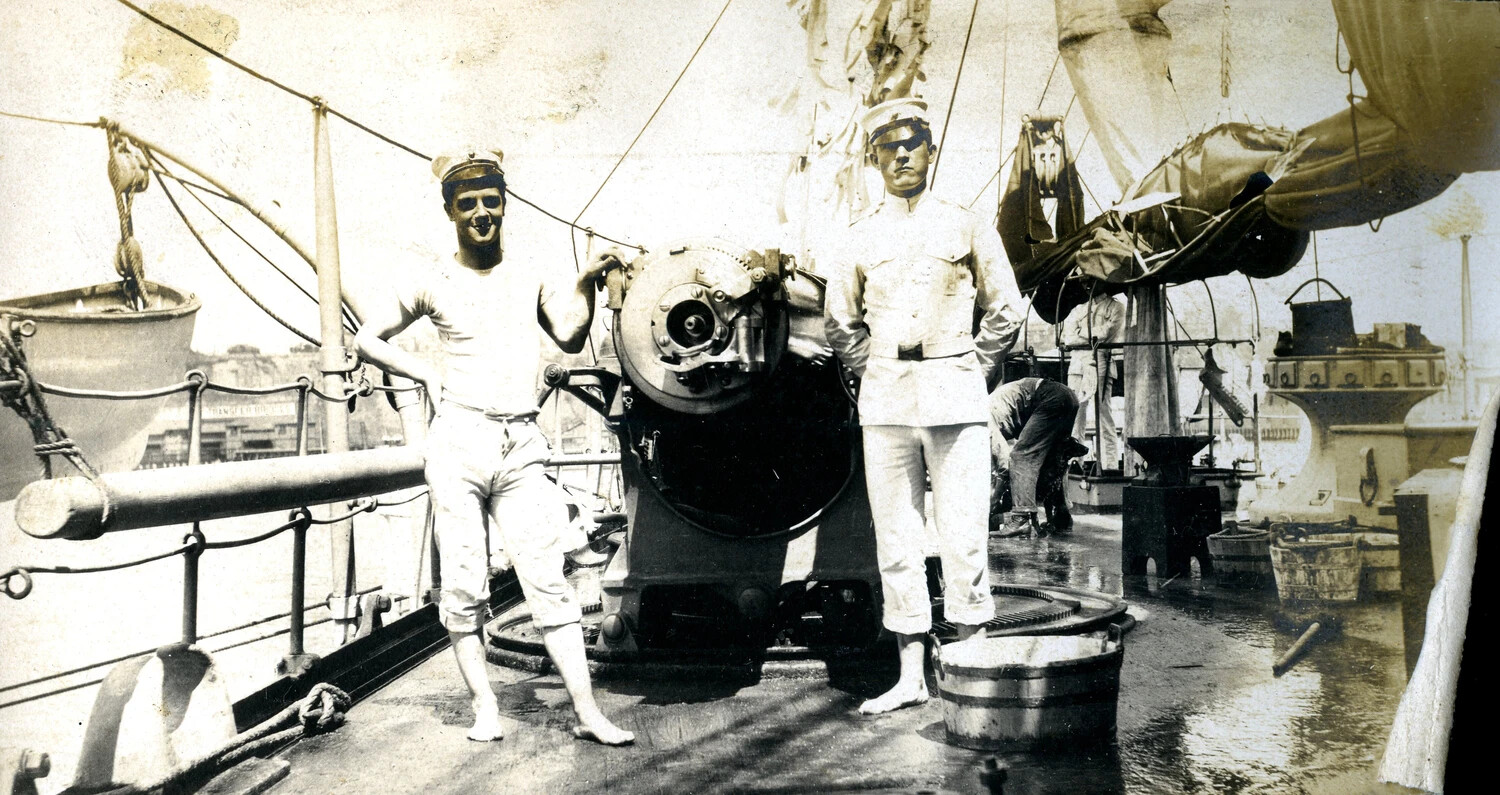 Two Sailors Posed at a Deck Gun During Shipboard Routine, U.S. Navy Cruiser, Early 1900s