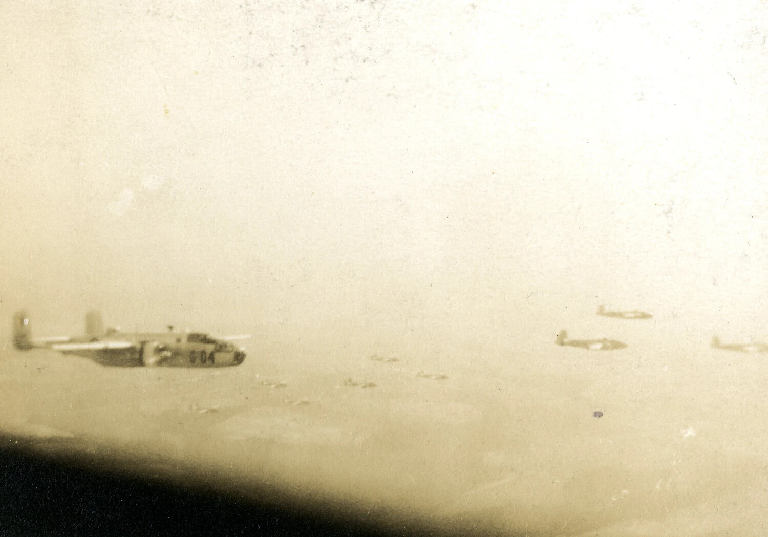 In-Flight Formation Photograph, B-25 Mitchell Bomber with Fighter Escort over Water, Ie Shima Envoy Mission, August 1945