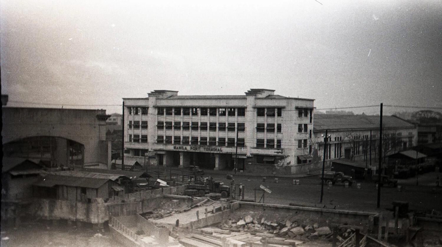 Manila Port Terminal Building with War Damage and U.S. Army Trucks, Philippines, 1945