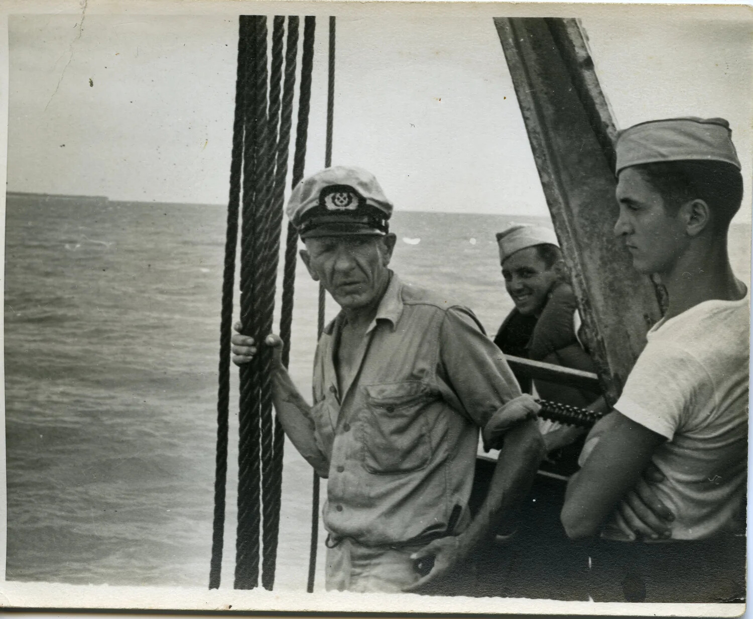 Naval Officer and Enlisted Crewmen on Deck at Sea, Pacific Theater, WWII
