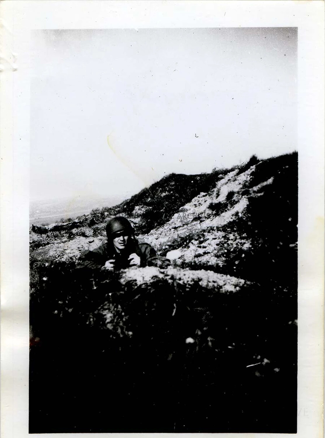 Paratrooper on Hillside Observation Post Overlooking a European Valley, WWII