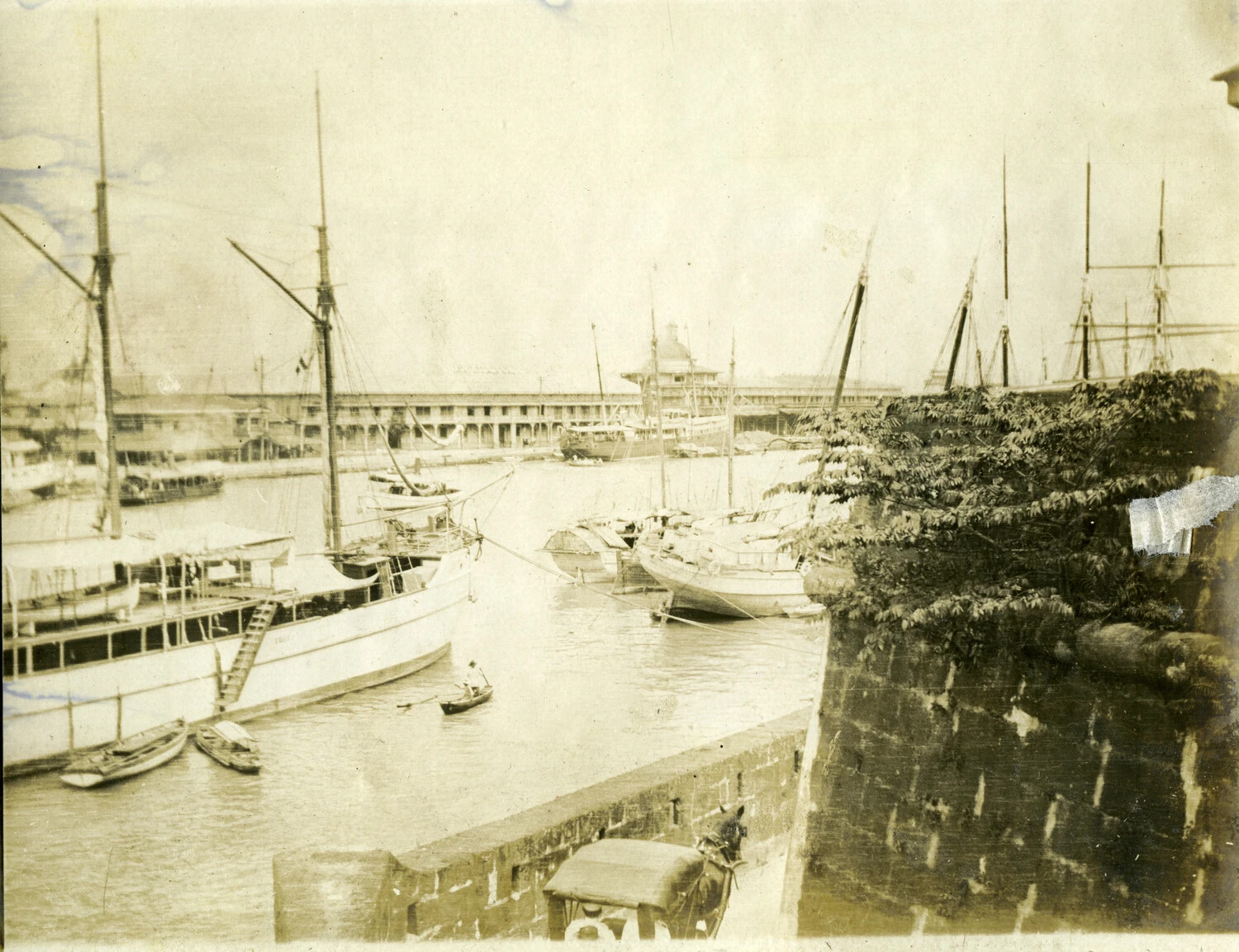 Waterfront View with Sailing Vessels Along Fortified Stone Wall, Manila/Pasig River, Philippines, Early 1900s