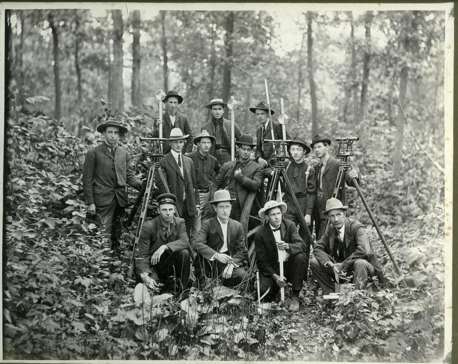 Early 20th-Century Surveying Crew Group Portrait with Transits and Leveling Rods (Misfiled Non-Vietnam Image)