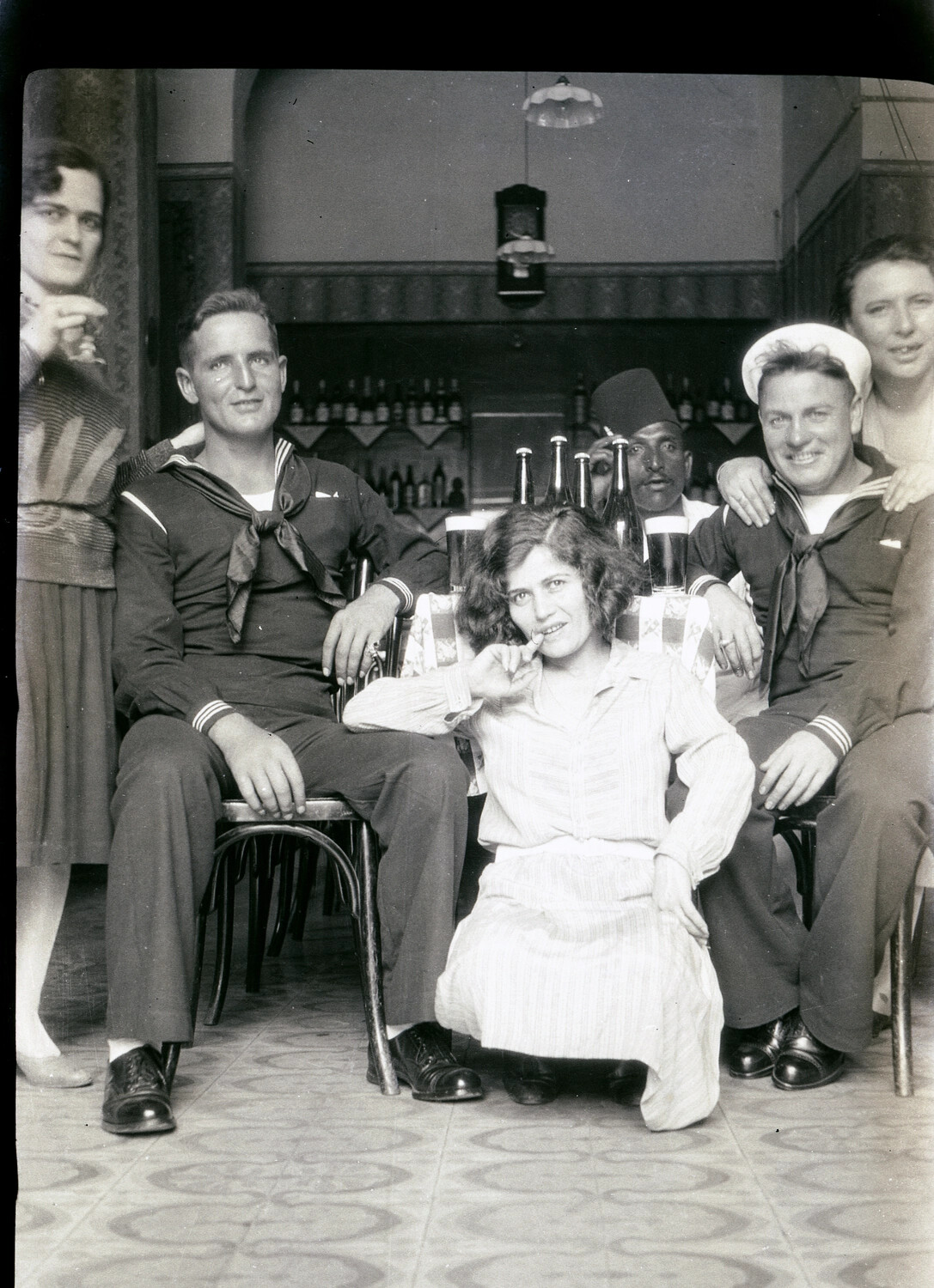 US Navy Sailors and Local Companions in a Bar, 1930s China/Pacific Cruise