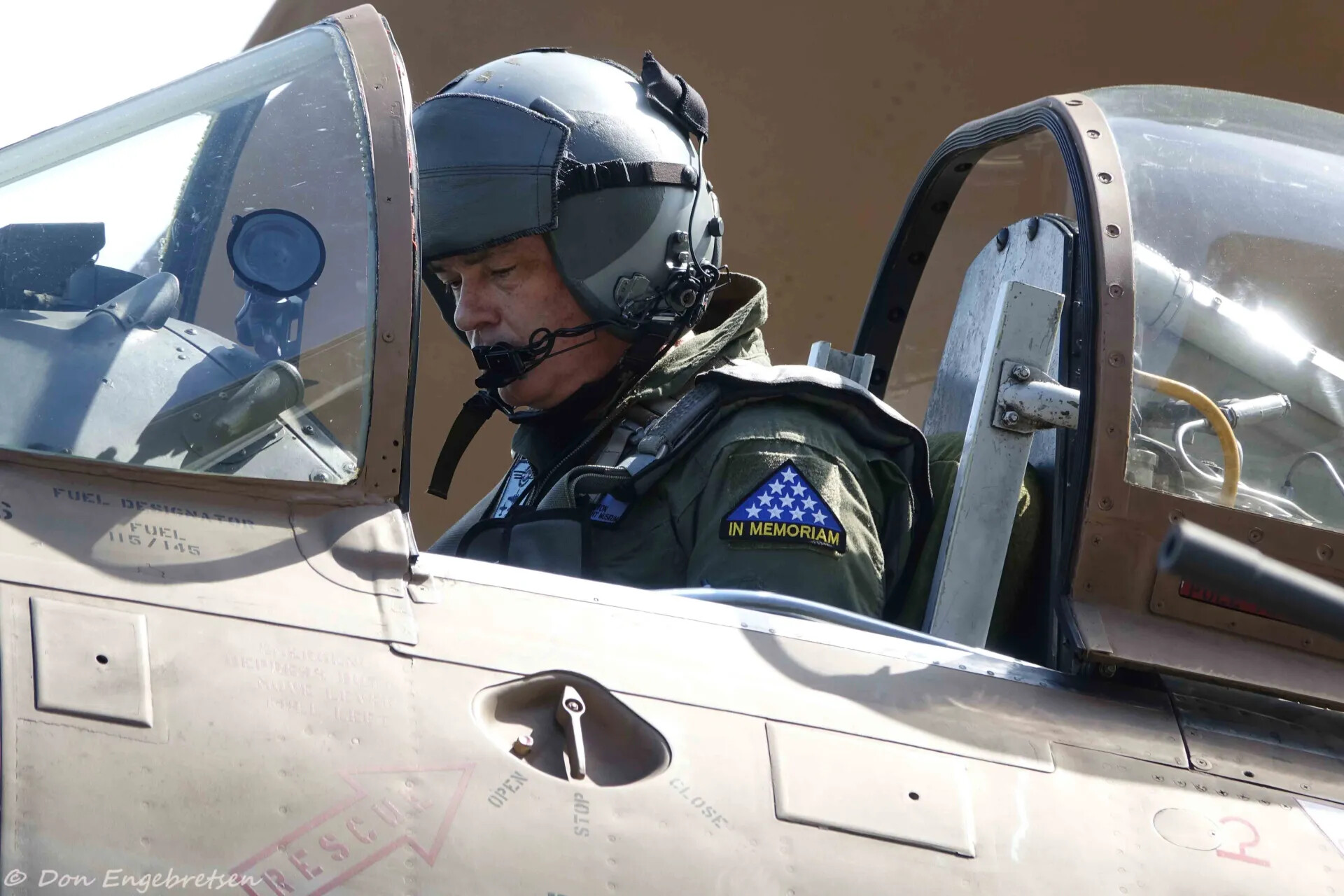 Pilot in Cockpit of Vintage Trainer Aircraft Wearing 'In Memoriam' Patch, May 2019 Event