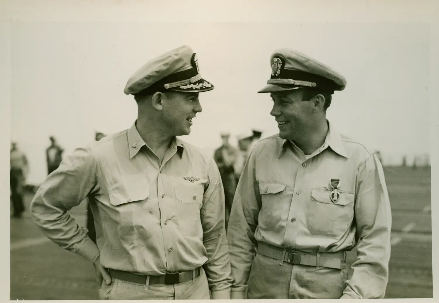 Two U.S. Navy Officers Conversing on Flight Deck, USS Petrof Bay (CVE-80)
