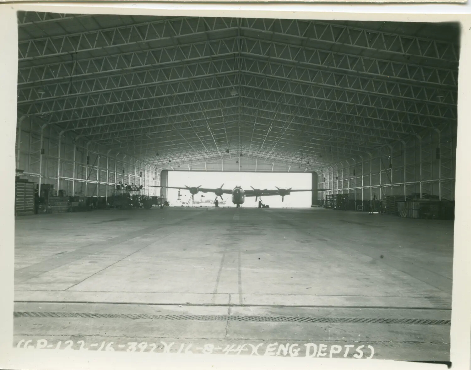 Aircraft Silhouetted in Hangar Doorway, 392nd Bomb Group Engineering Department, 8 November 1944