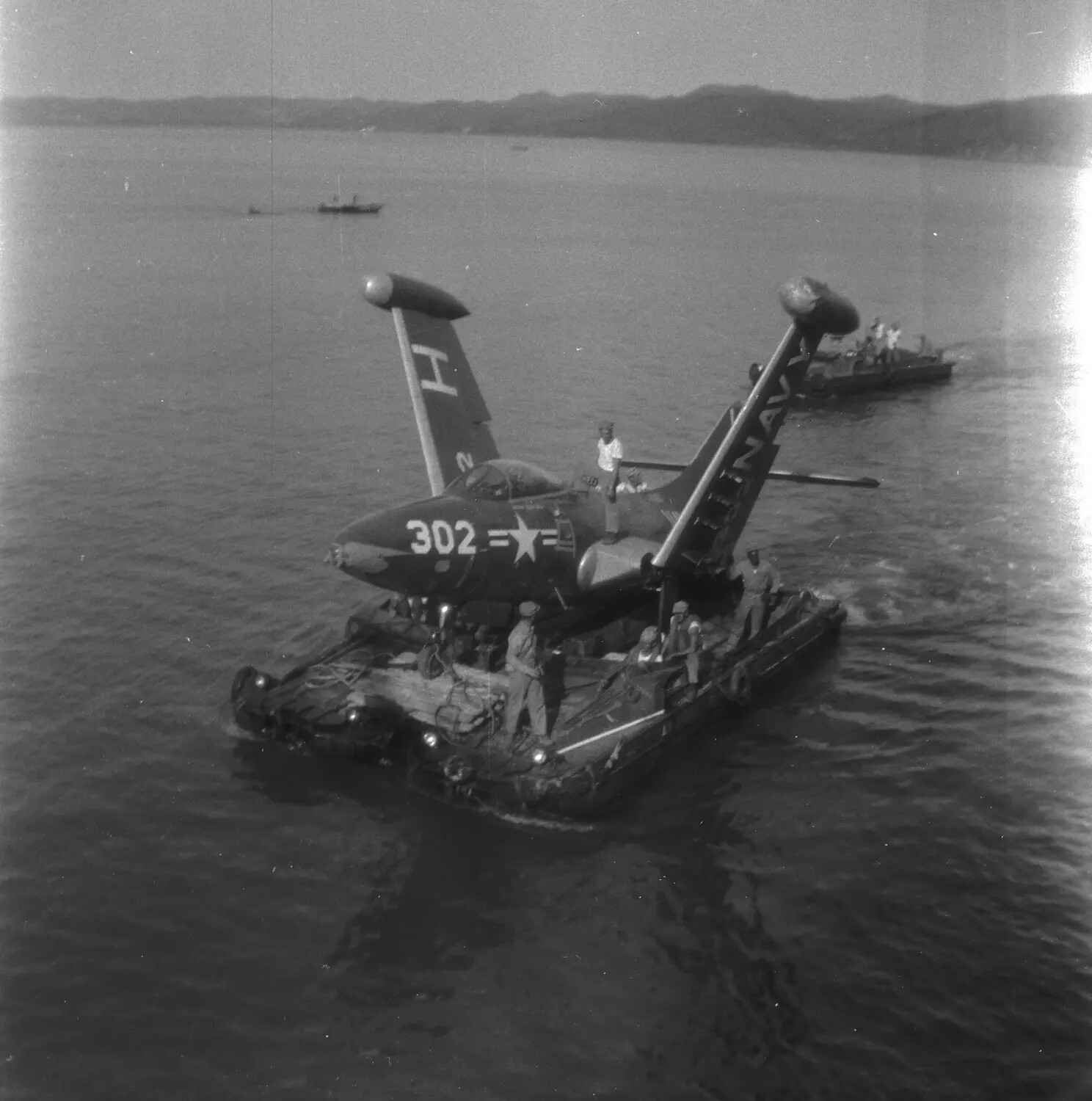 U.S. Navy Jet Fighter Recovery Aboard Salvage Pontoon, Sasebo Harbor, Japan