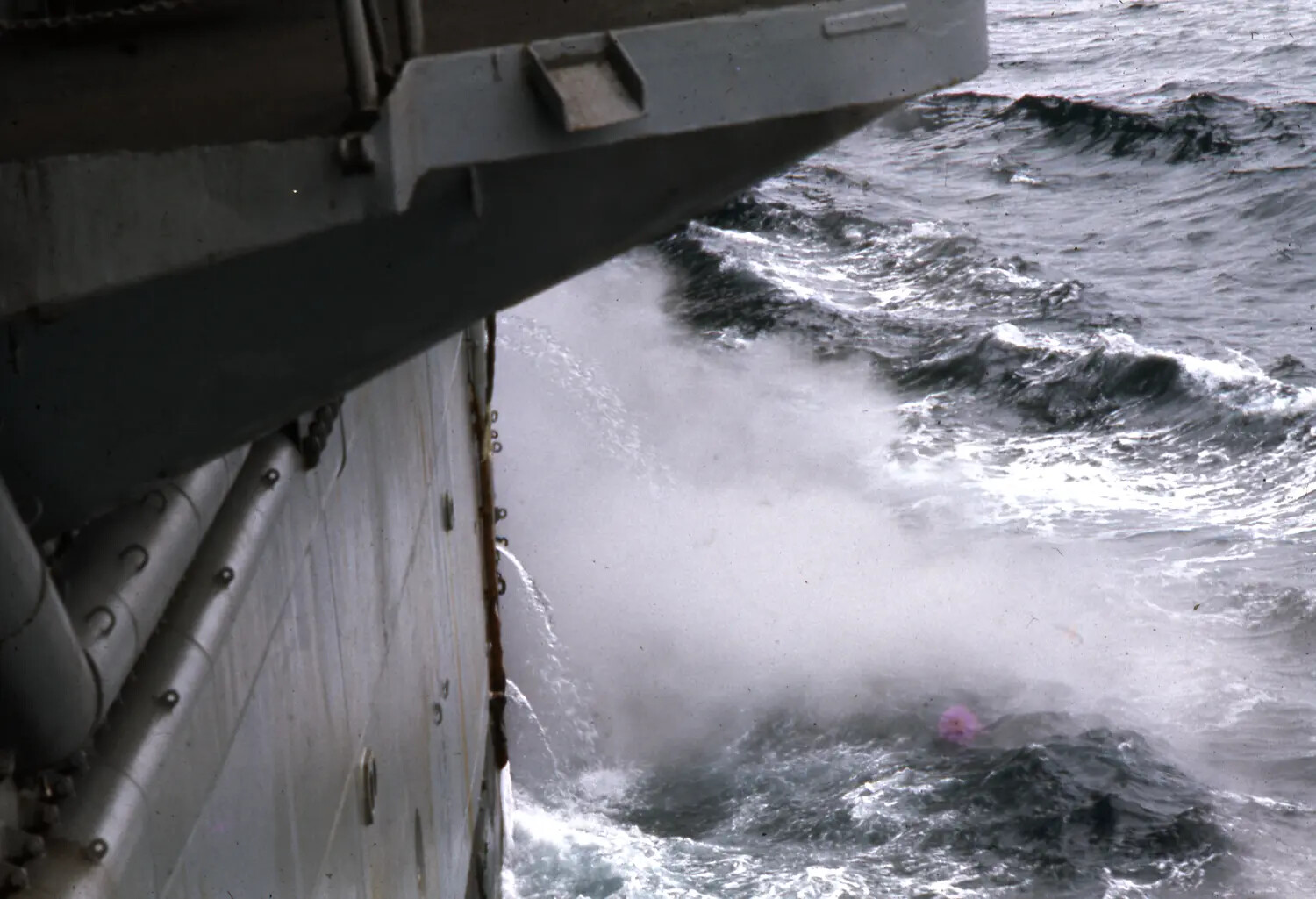 Aircraft Carrier Bow Plowing Through Rough Seas