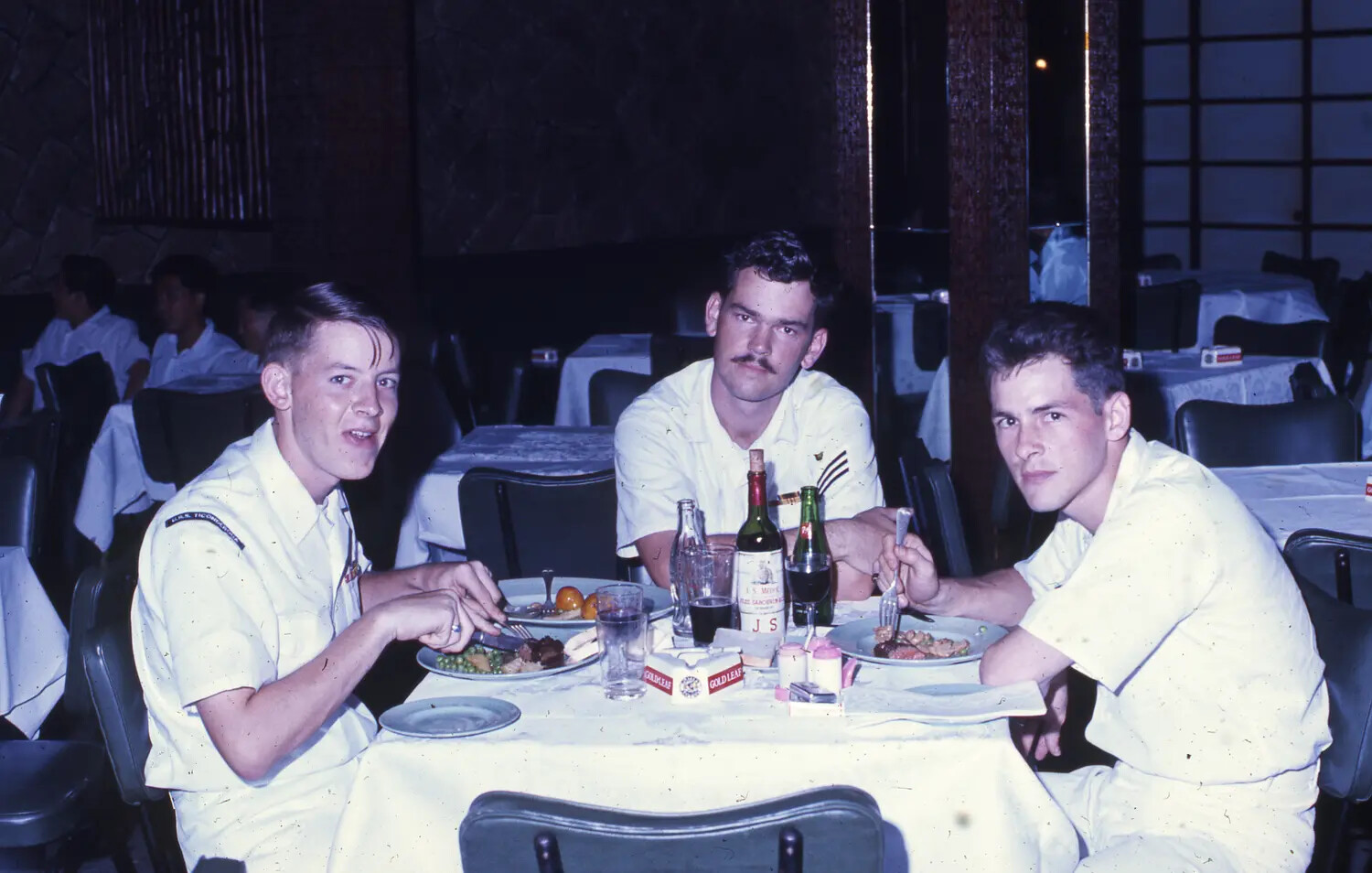 Three USS Ticonderoga Sailors Dining Ashore, Vietnam War Era