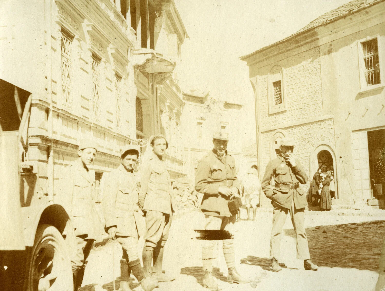 French Servicemen on a Town Street, WWI French Pilot Album, Likely Salonika Front
