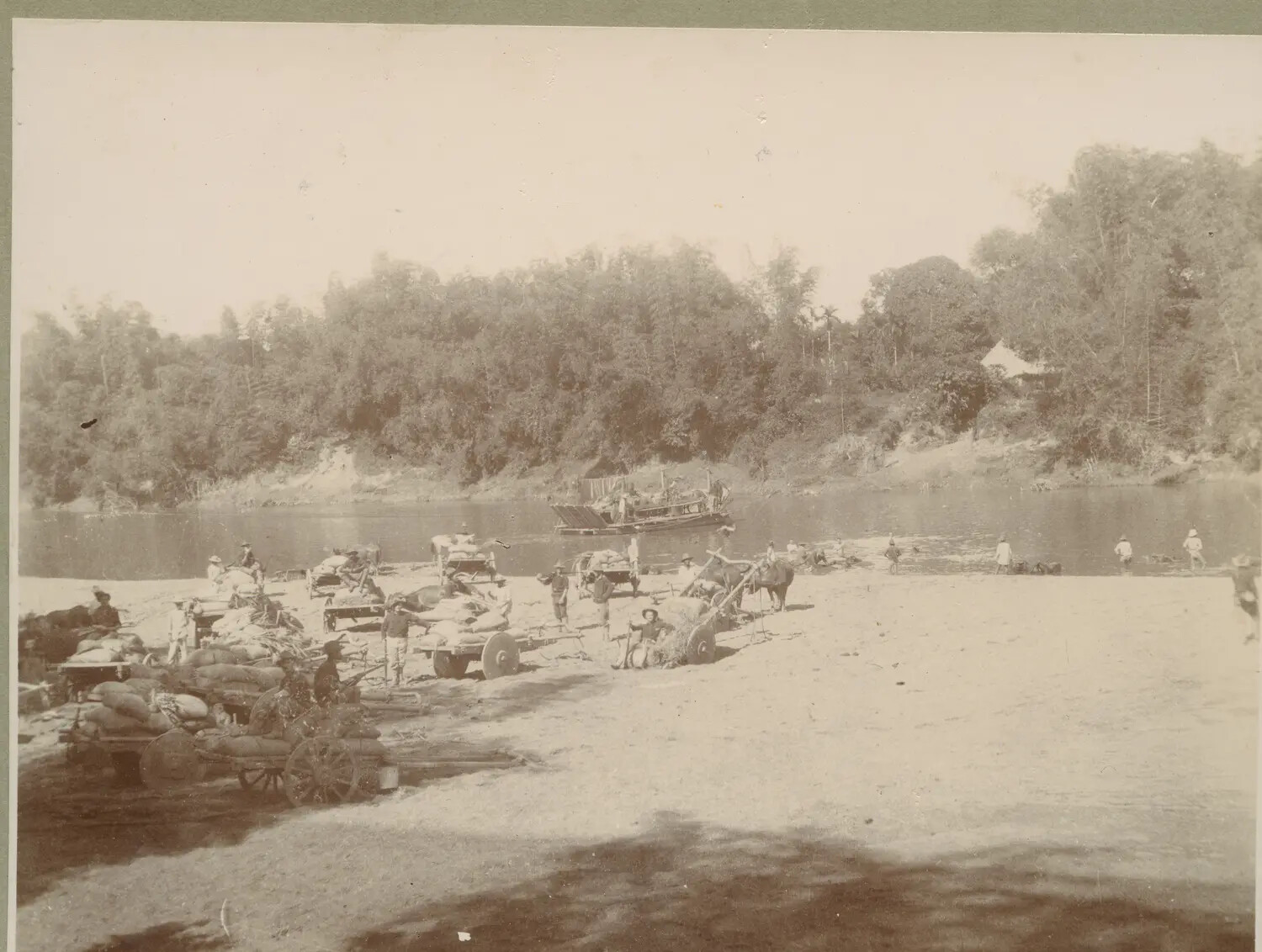 Supply Carts and River Barge at a Riverbank Staging Area, Philippines, c. 1899-1902