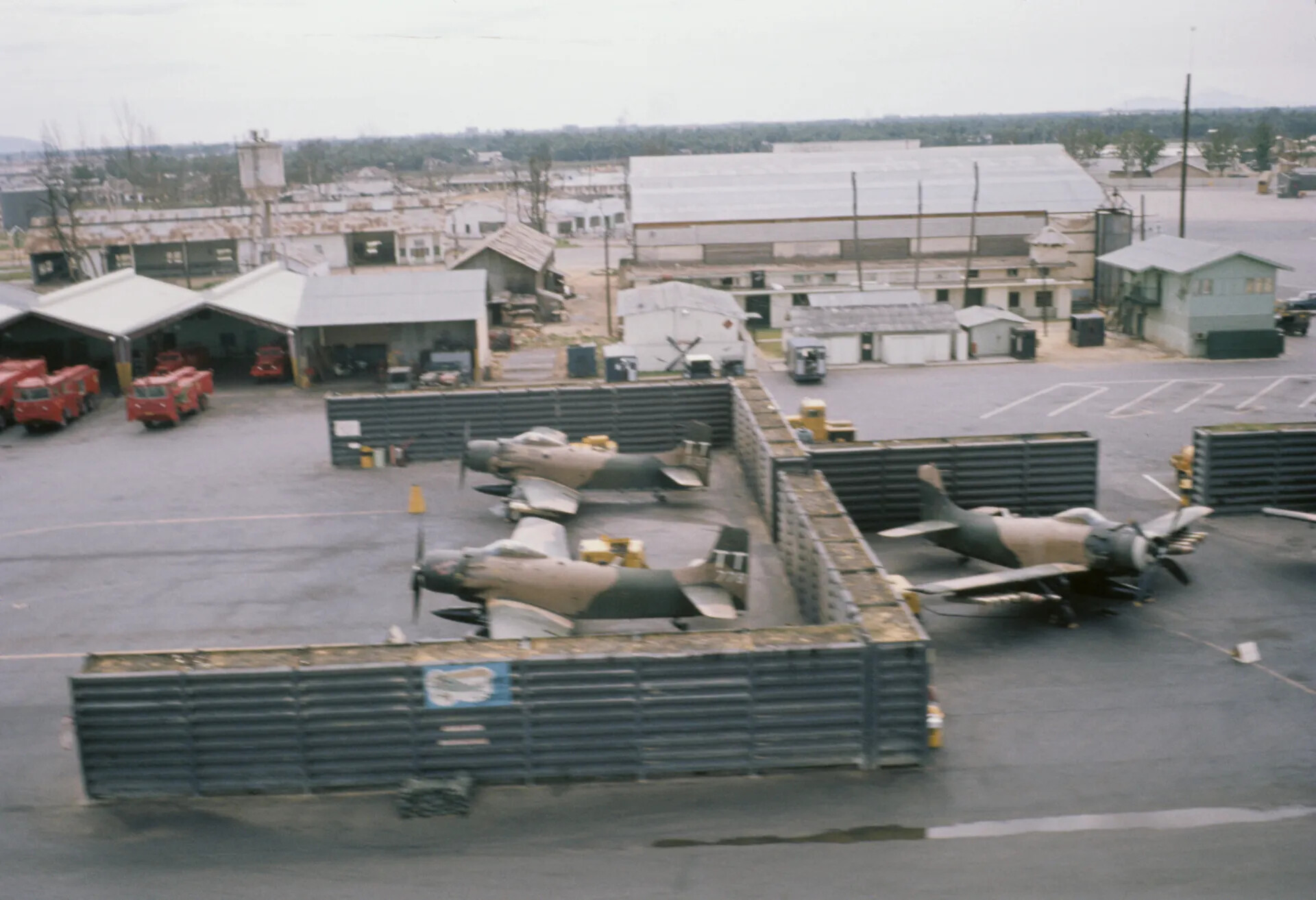 A-1 Skyraiders in Blast Revetments with Squadron Emblem, USAF Airbase, Vietnam War Era