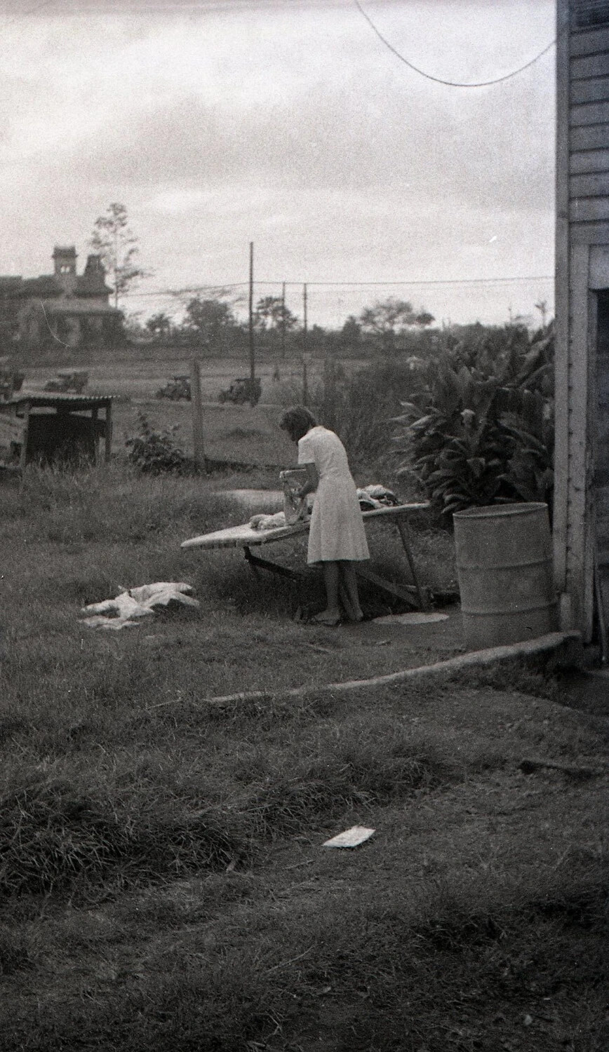 Filipina Woman Doing Laundry Near U.S. Military Encampment, Luzon, Philippines, World War II