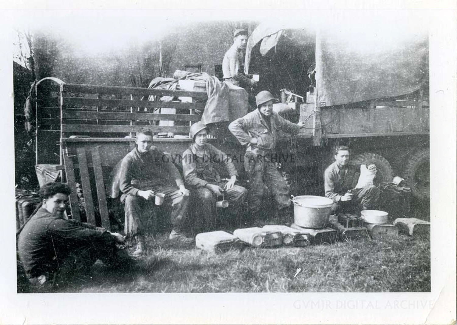 101st Airborne Division Paratroopers at a Field Chow Break Beside a GMC CCKW Cargo Truck, European Theater, WWII